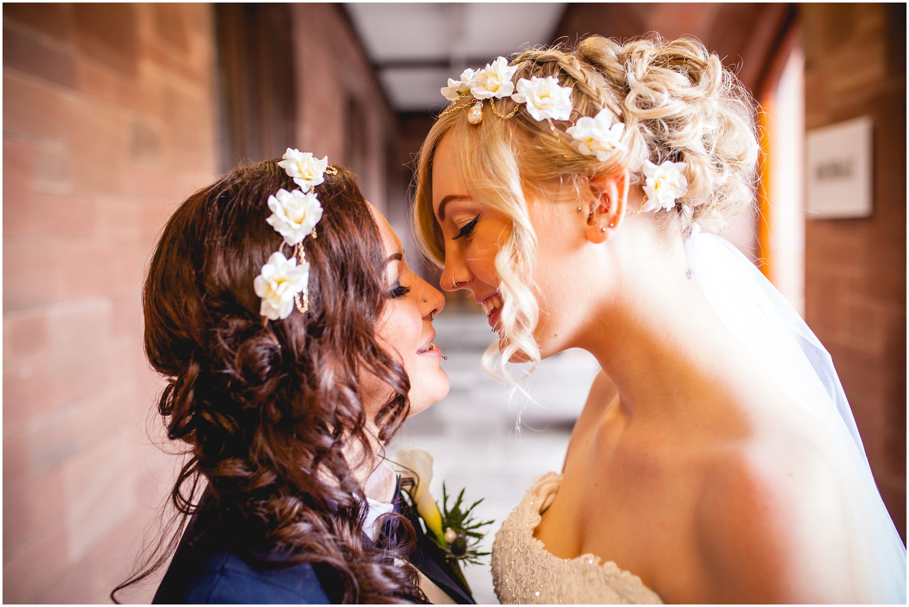 Two brides share a moment at Bolton School