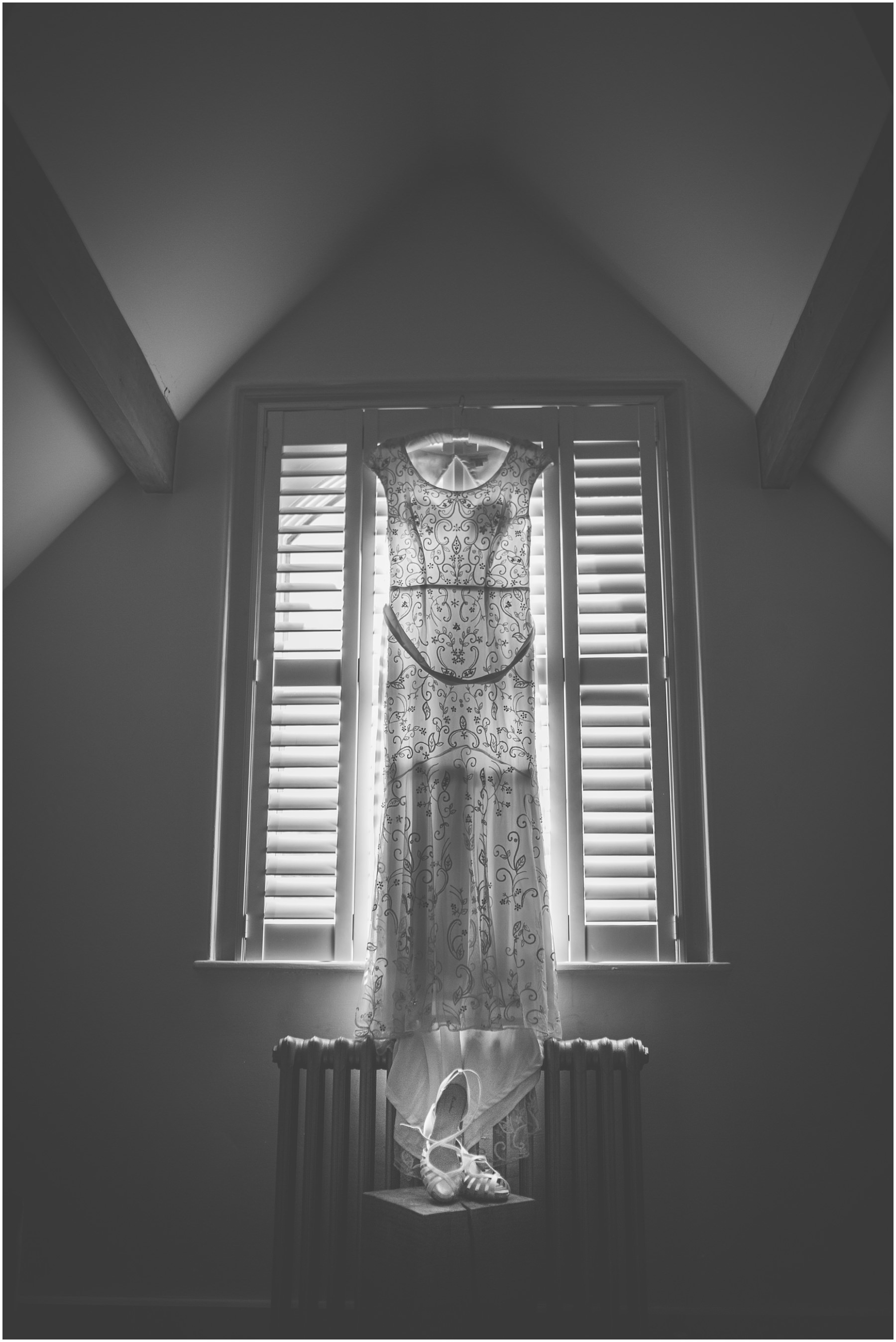 Wedding dress hangs in the bedroom of Didsbury House Hotel