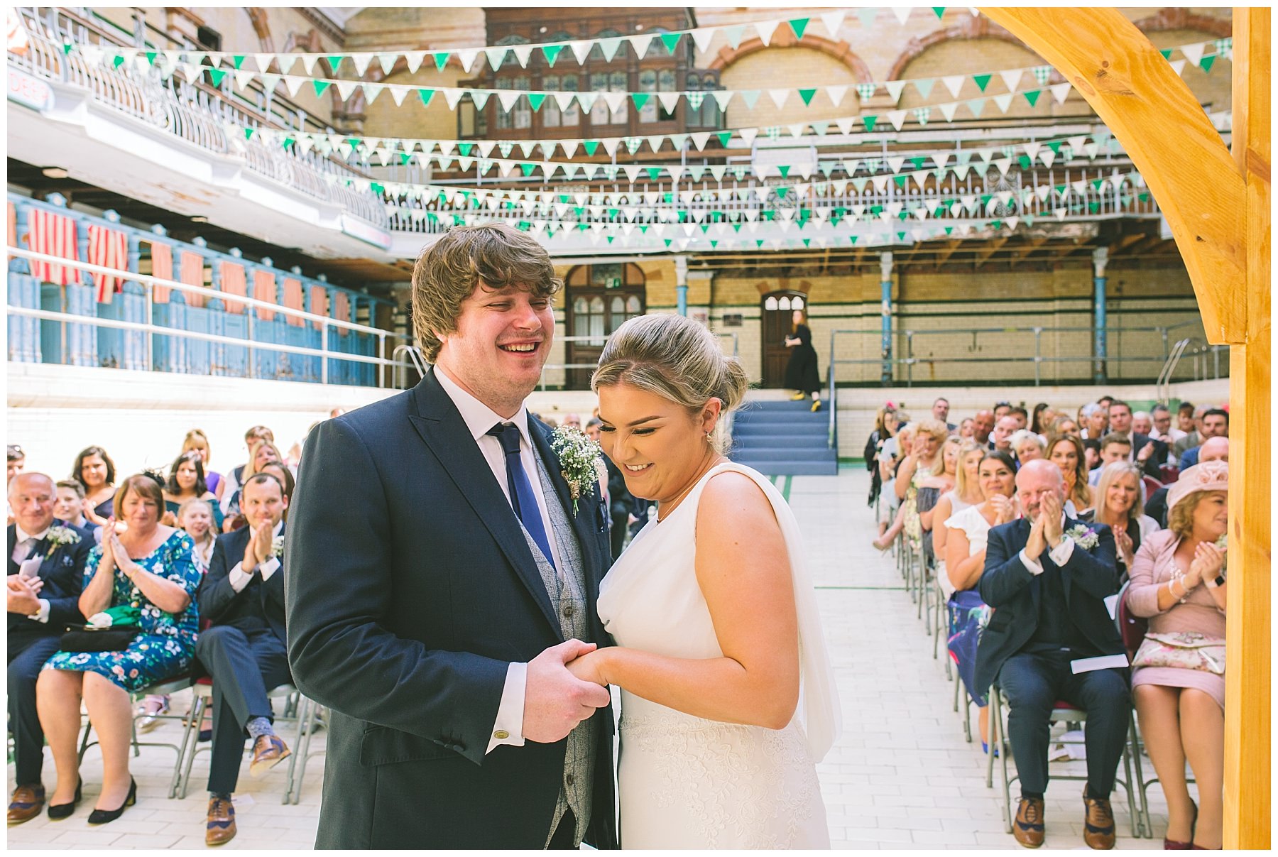 Bride and Groom laugh during the ceremony at Victoria Baths
