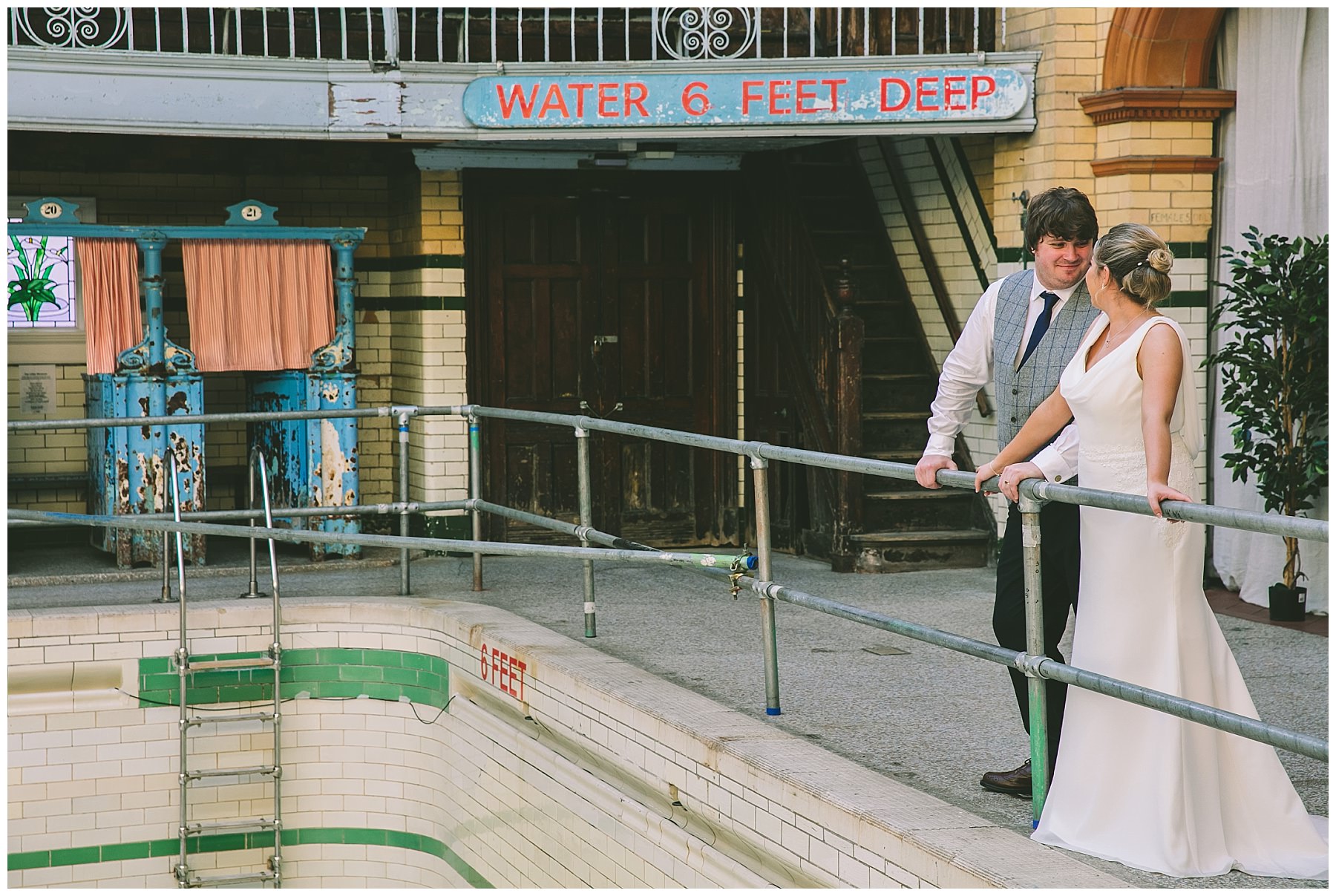 Bride and Groom at the deep end of the pool at Victoria Baths