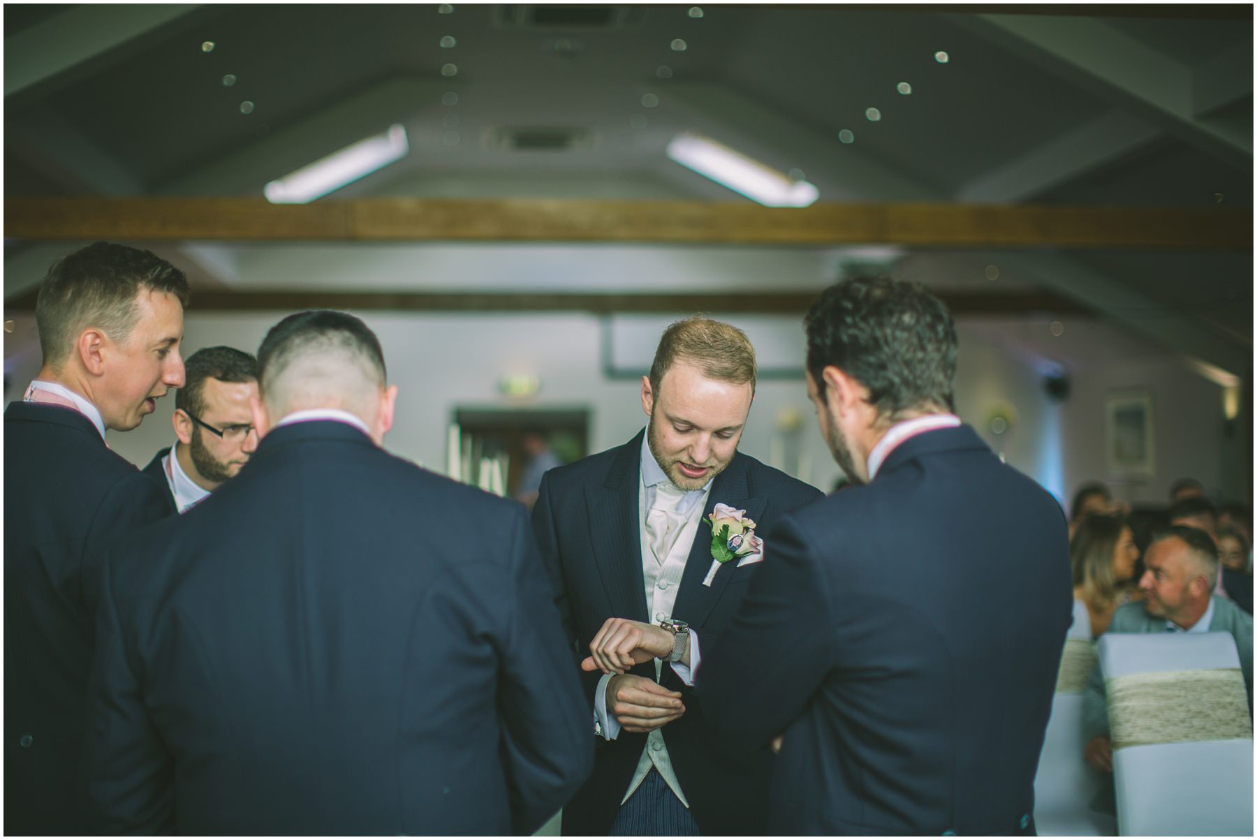 Groom checks the time at the fishermans retreat