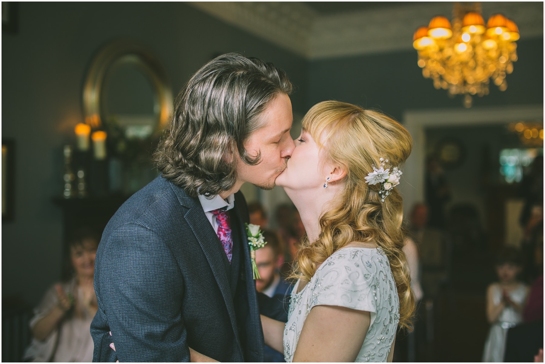 Bride and Grooms first kiss in the blue room at didsbury house hotel