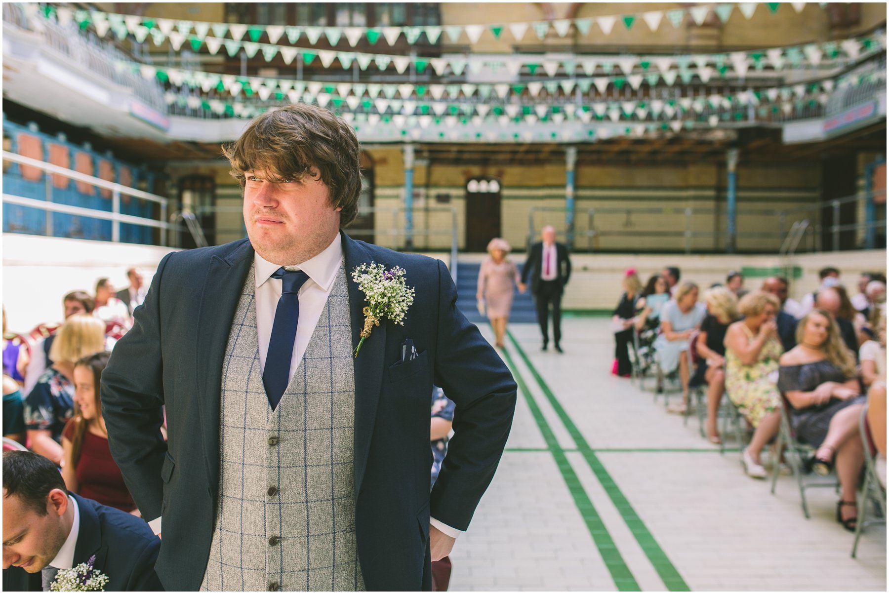 groom waits nervously in the pool at Victoria Baths