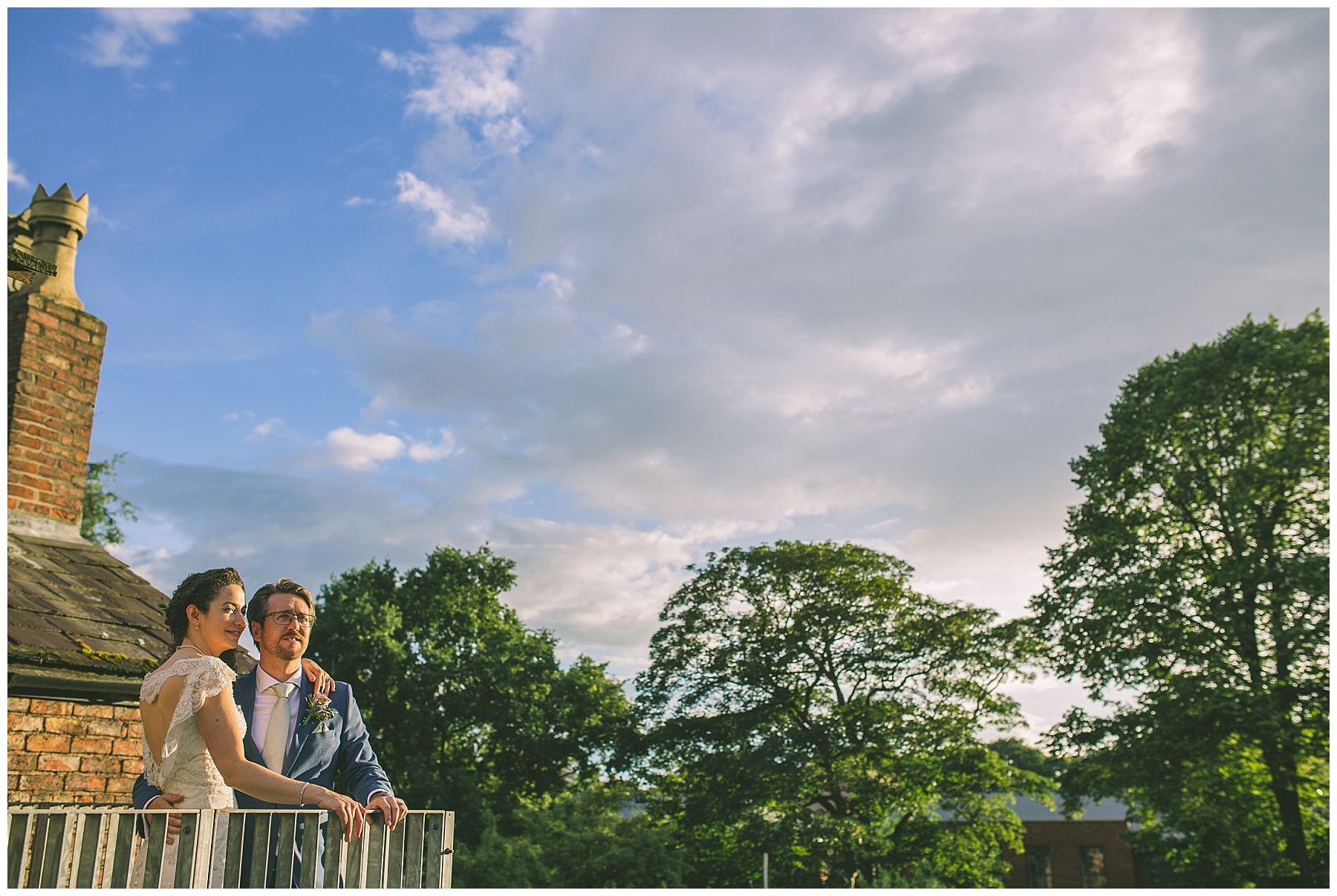 Married couple take in the sunset from the roof of Eleven Didsbury Park
