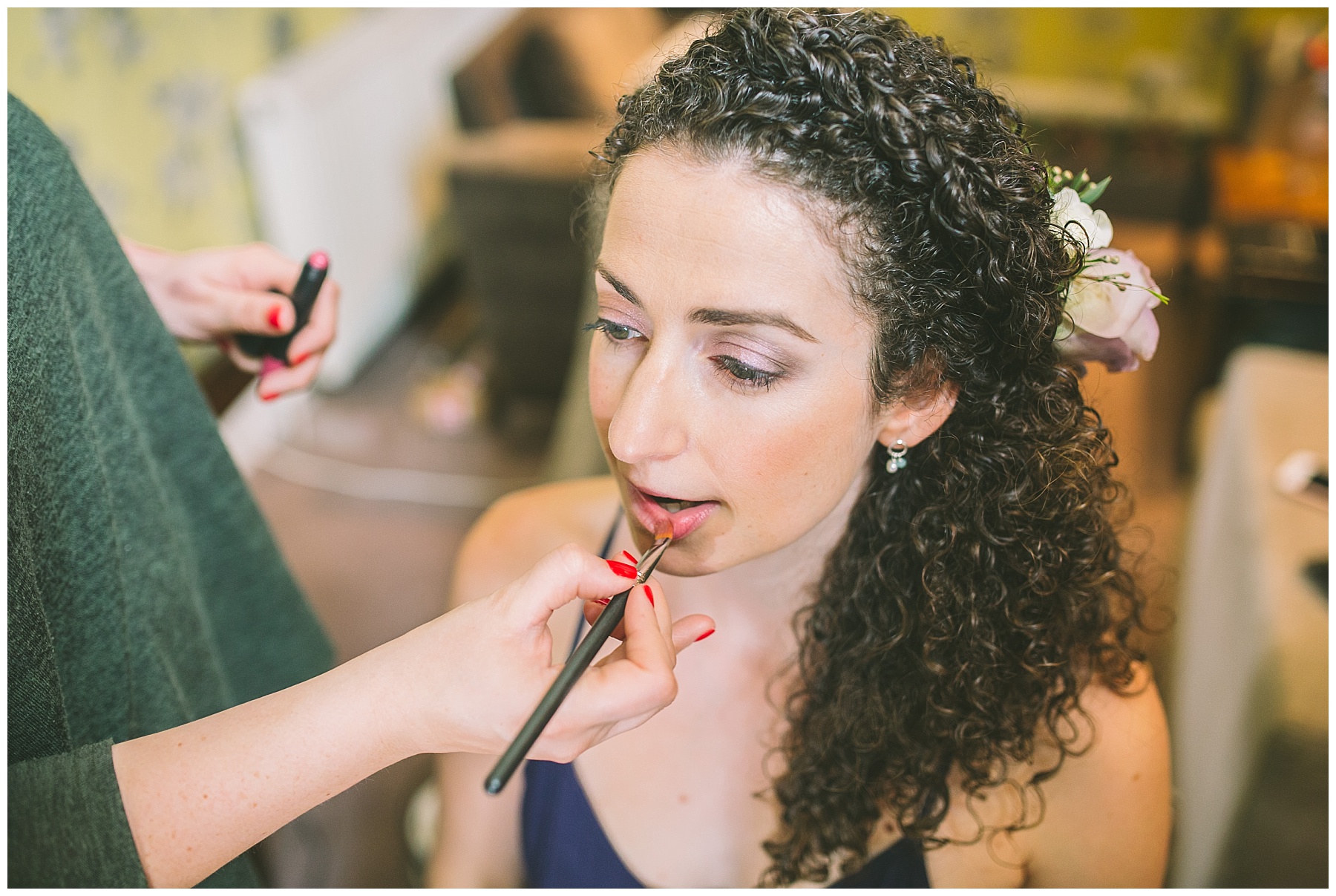 bride has lipstick applied for her didsbury wedding
