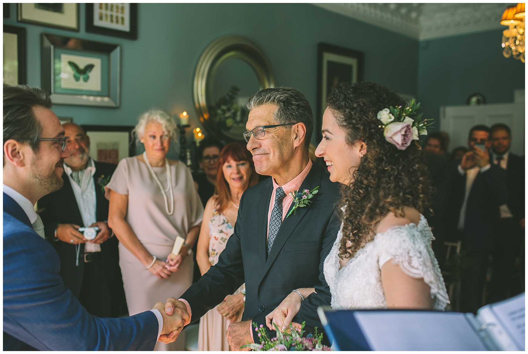 Father of the bride shakes hands with the groom