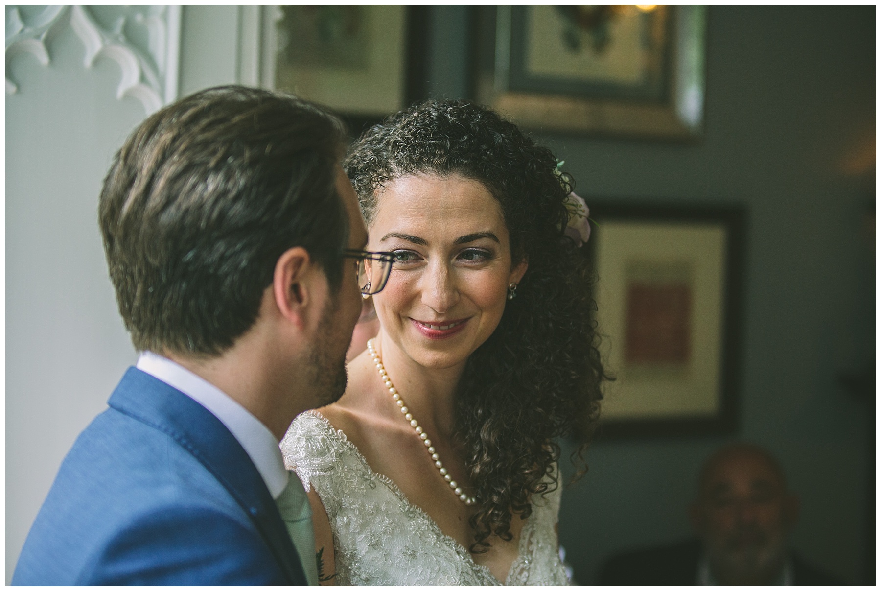bride and groom exchange a look during the ceremony at Didsbury House
