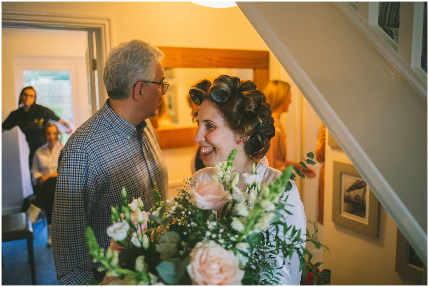 Bride receives a bunch of flowers on the morning of her wedding