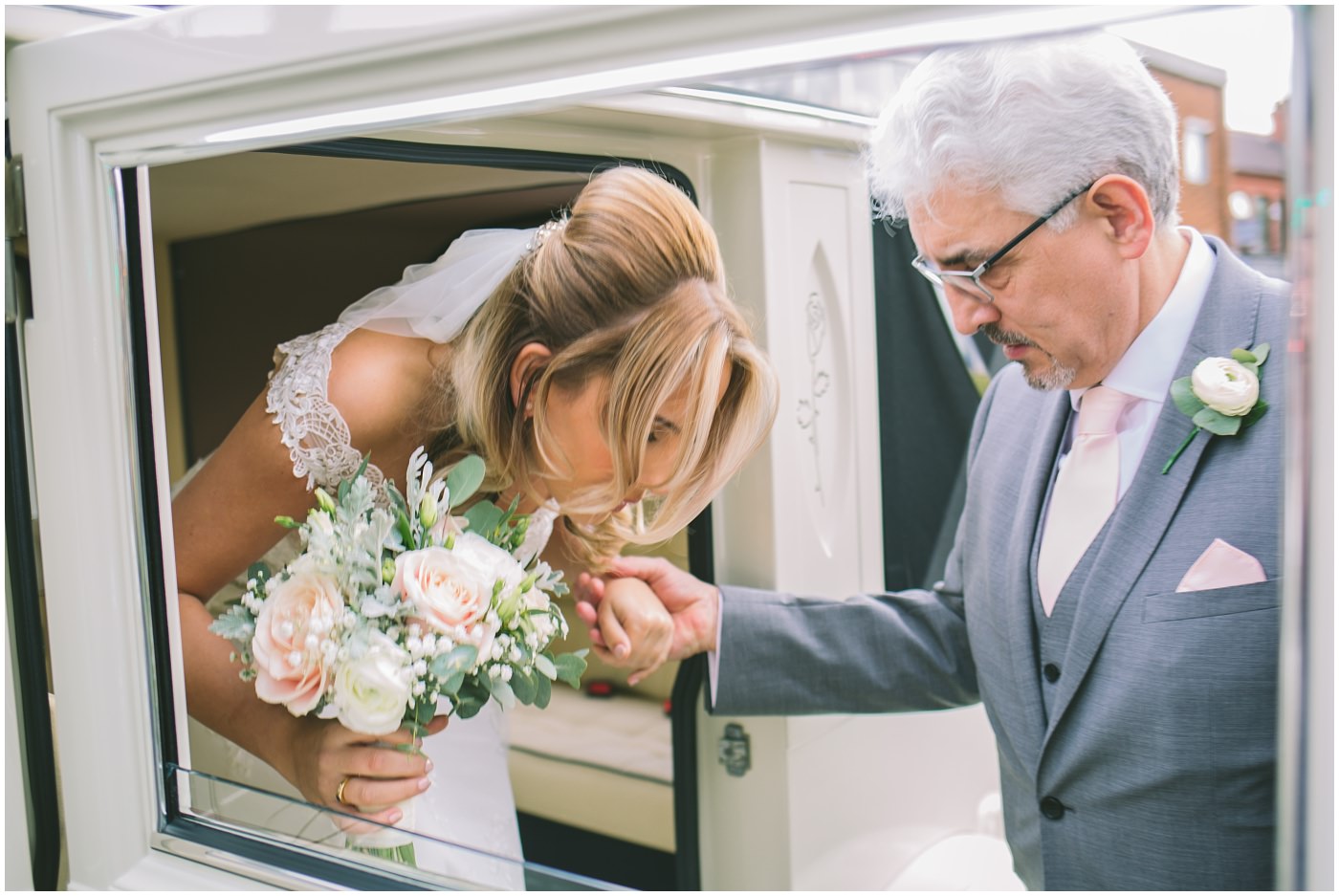 brides father helps her out of the wedding car