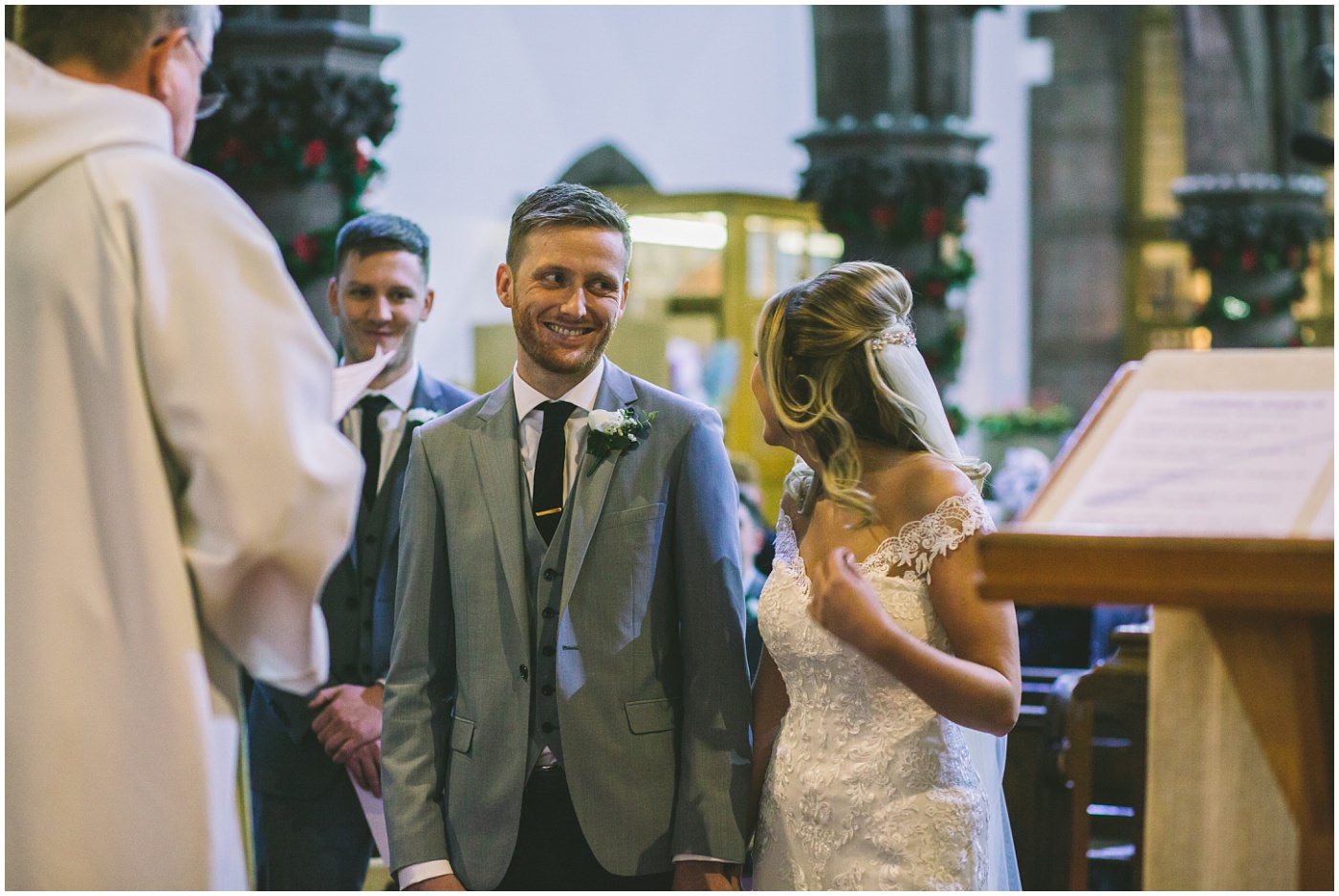 groom smiles as he sees his bride 
