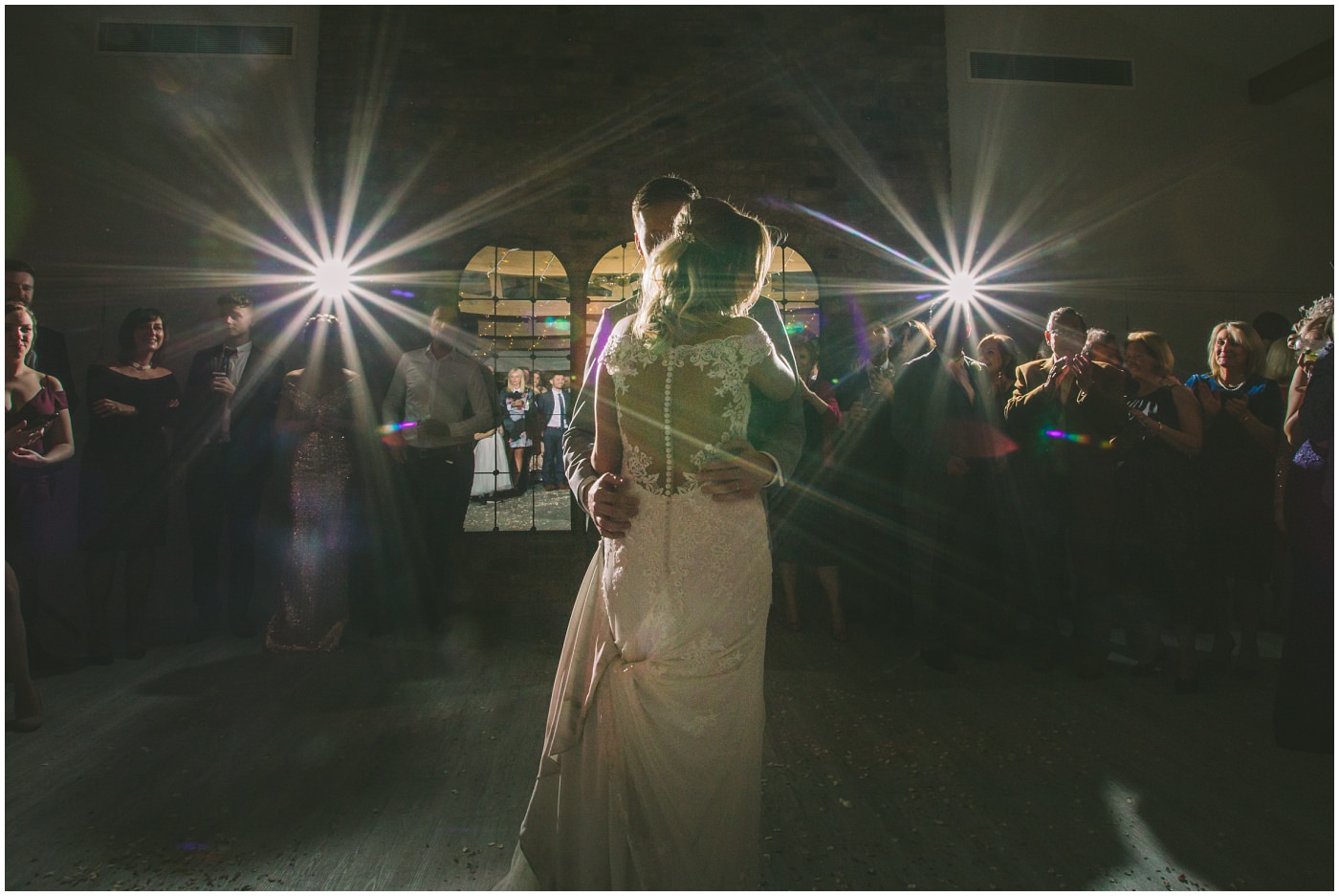 Bride and Groom embrace on the dance floor
