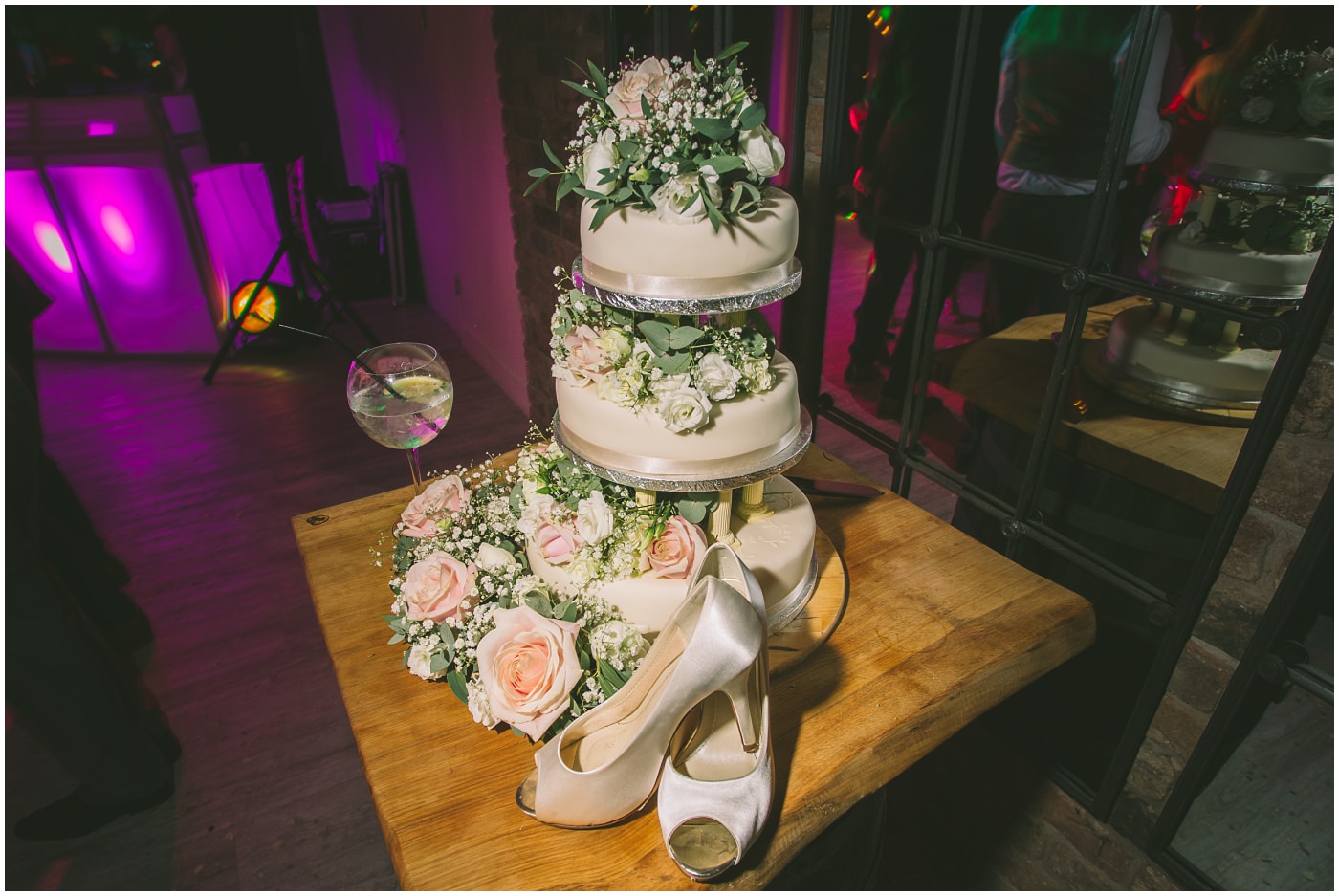 Cake and brides shoes on display at Pryors Hayes