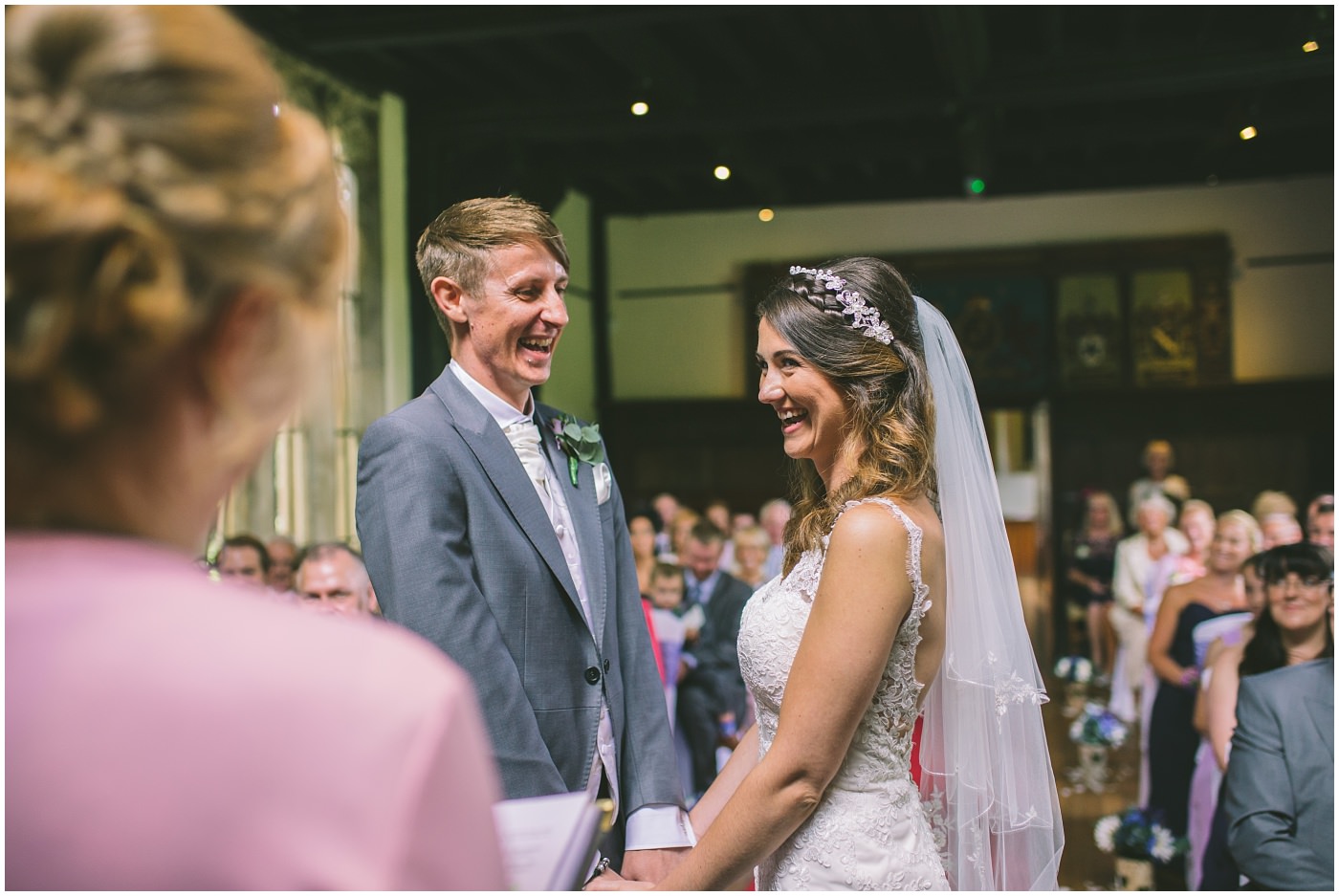 Happy couple are all smiles in their wedding ceremony