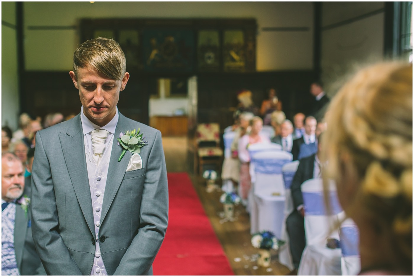 groom waits nervously for his bride