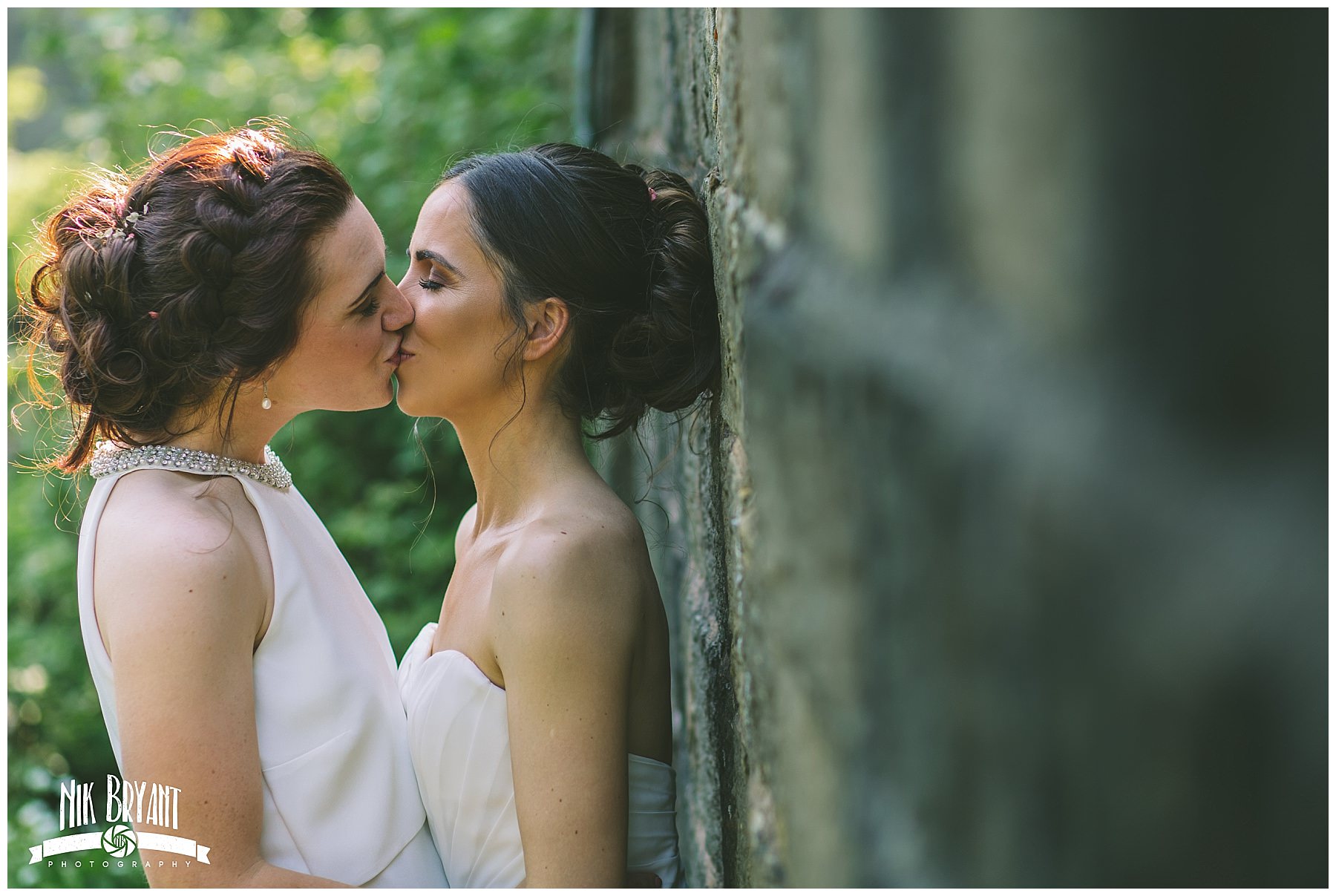 two brides share a kiss after getting married