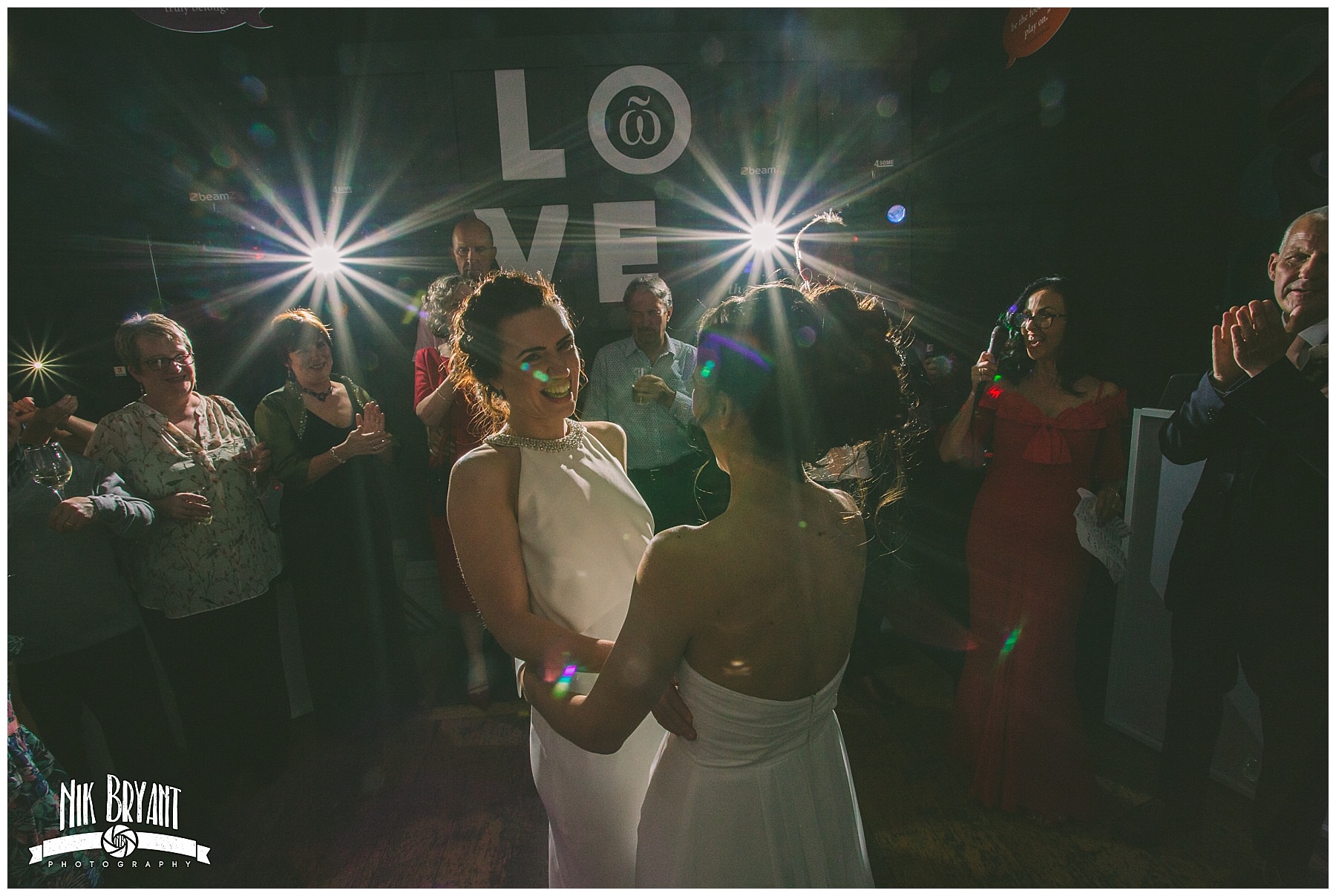 Two brides share their first dance with family and friends