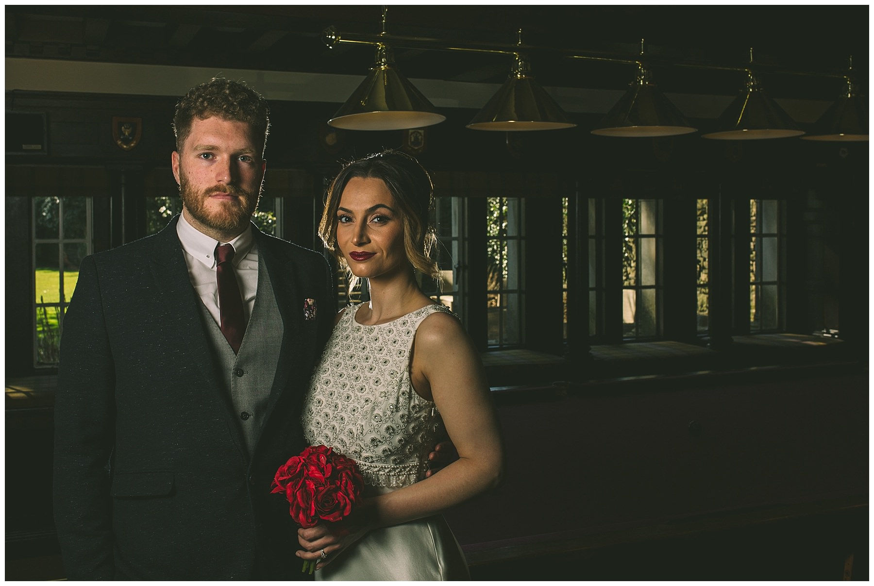 Bridal couple int the snooker room at Eaves hall