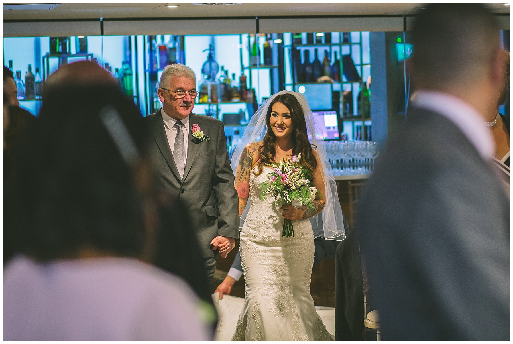 brides father walks her down the isle at king street town house
