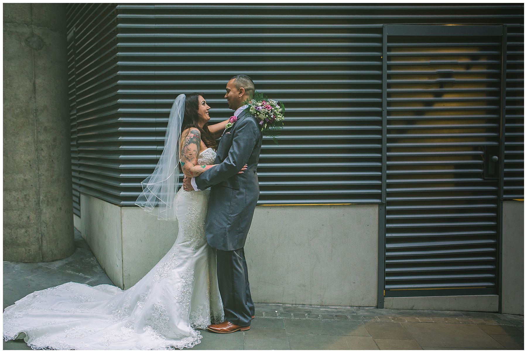bride and groom portraits on the streets of manchester