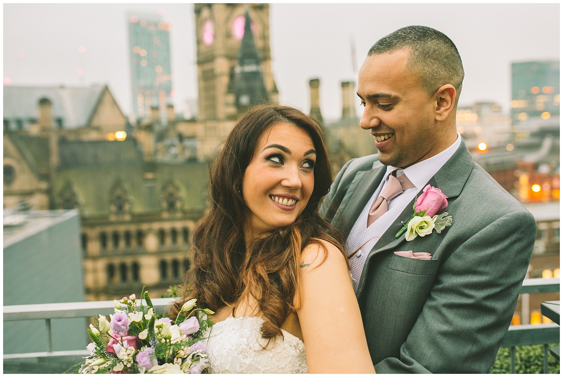 married couple stand on the roof of king street townhouse