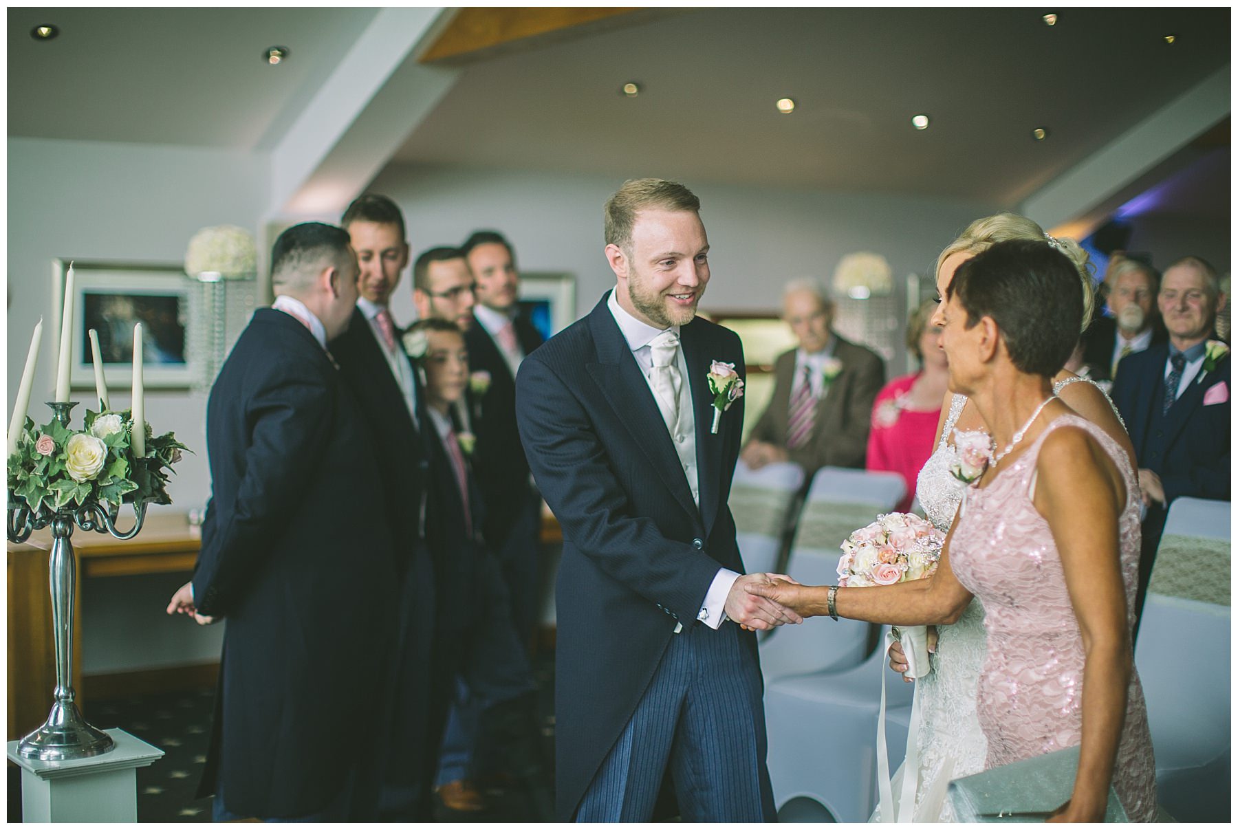 Groom Shakes hands with mother of the bride