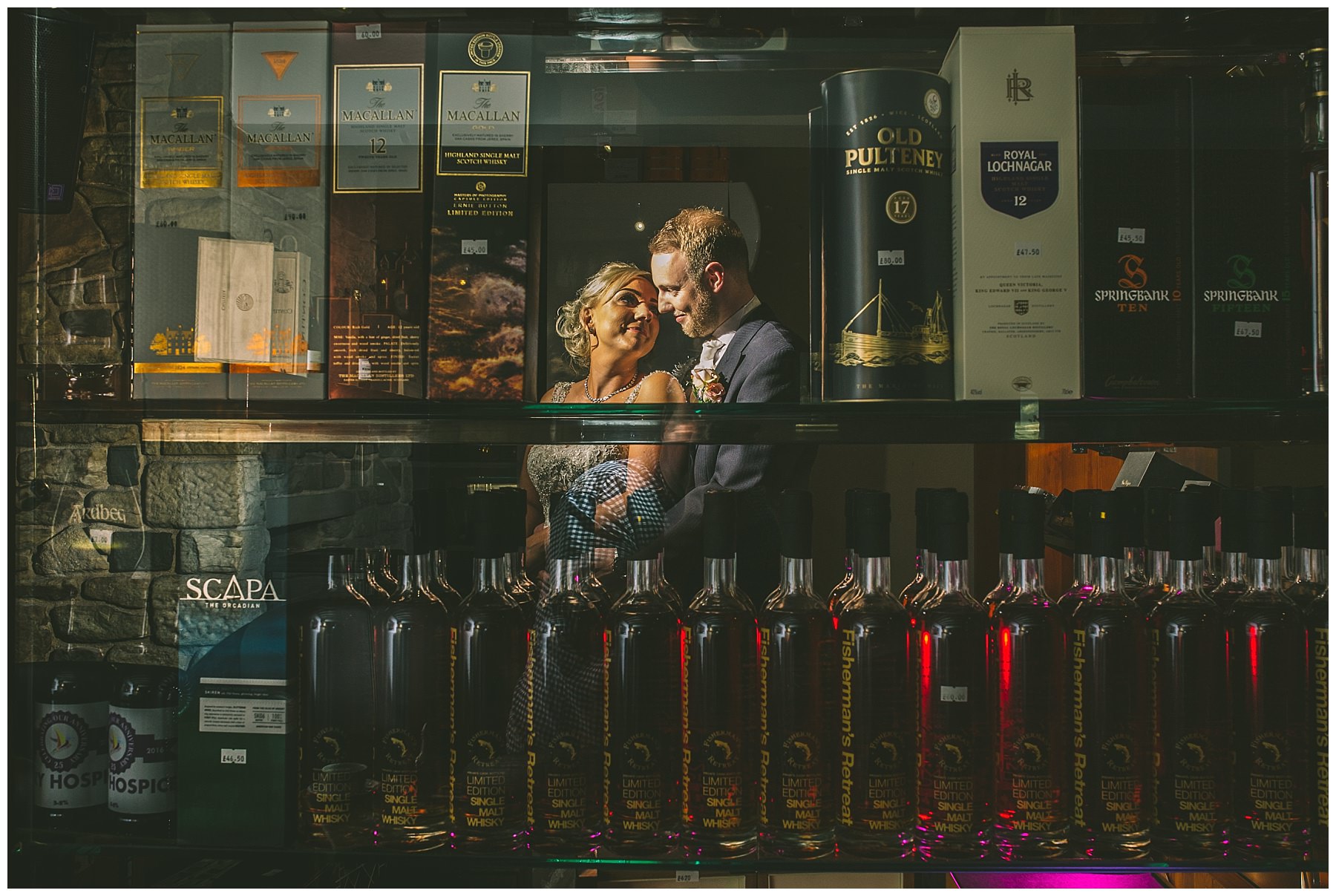 Creative portrait of the bride and groom in the whiskey room