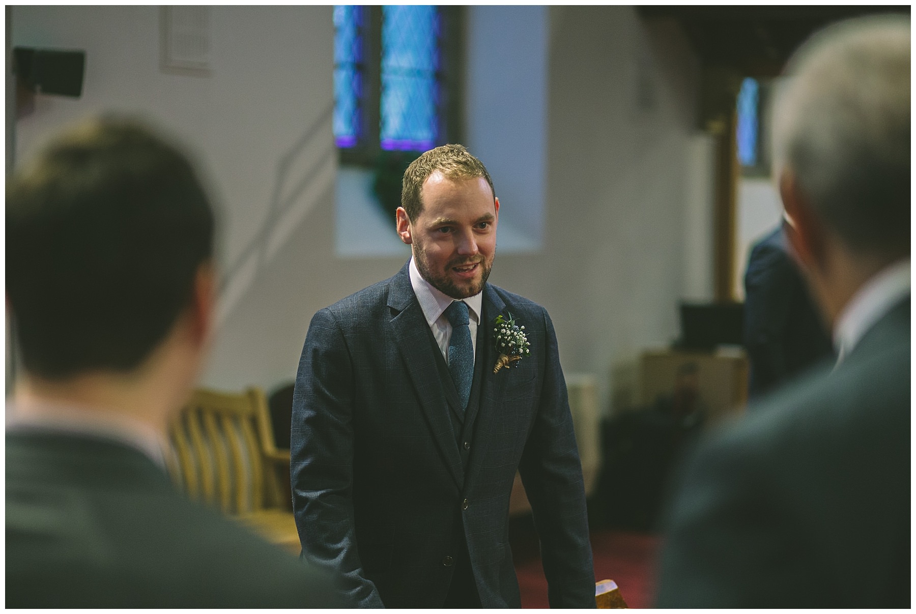 Groom waits for his bride in church