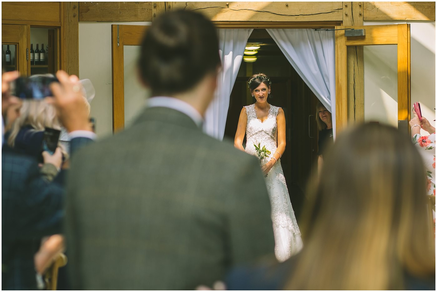 bride makes her entrance at the oaktree of peover