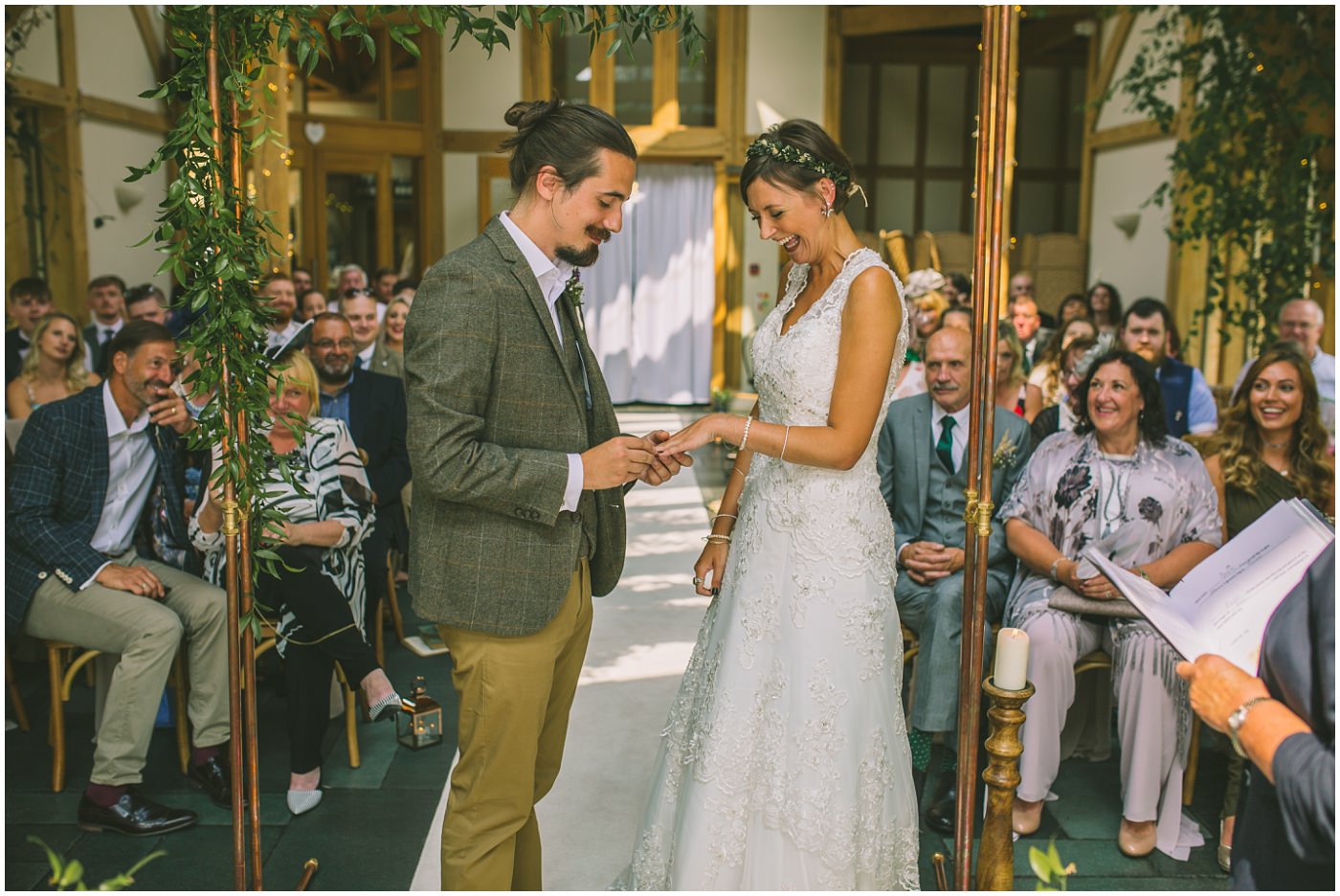 Groom exchanges rings with his bride during knutsford wedding