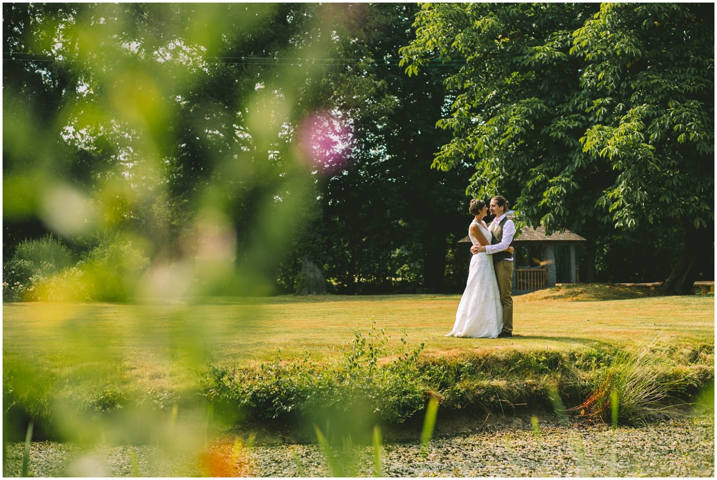 Bride and Groom shot on the lawns over the lake