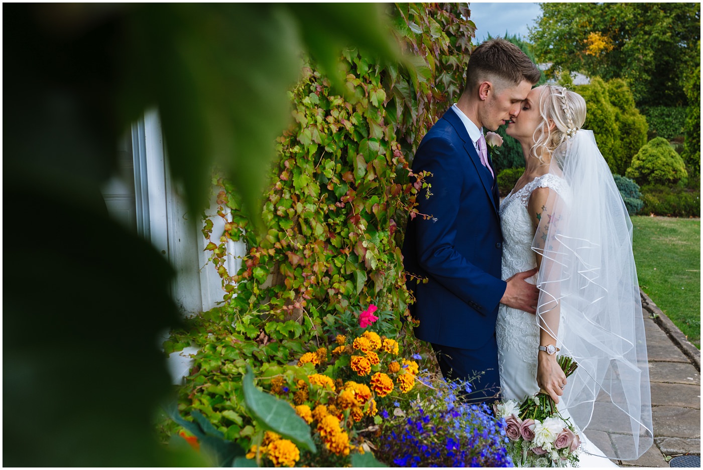 tattooed wedding couple kiss at waterton park