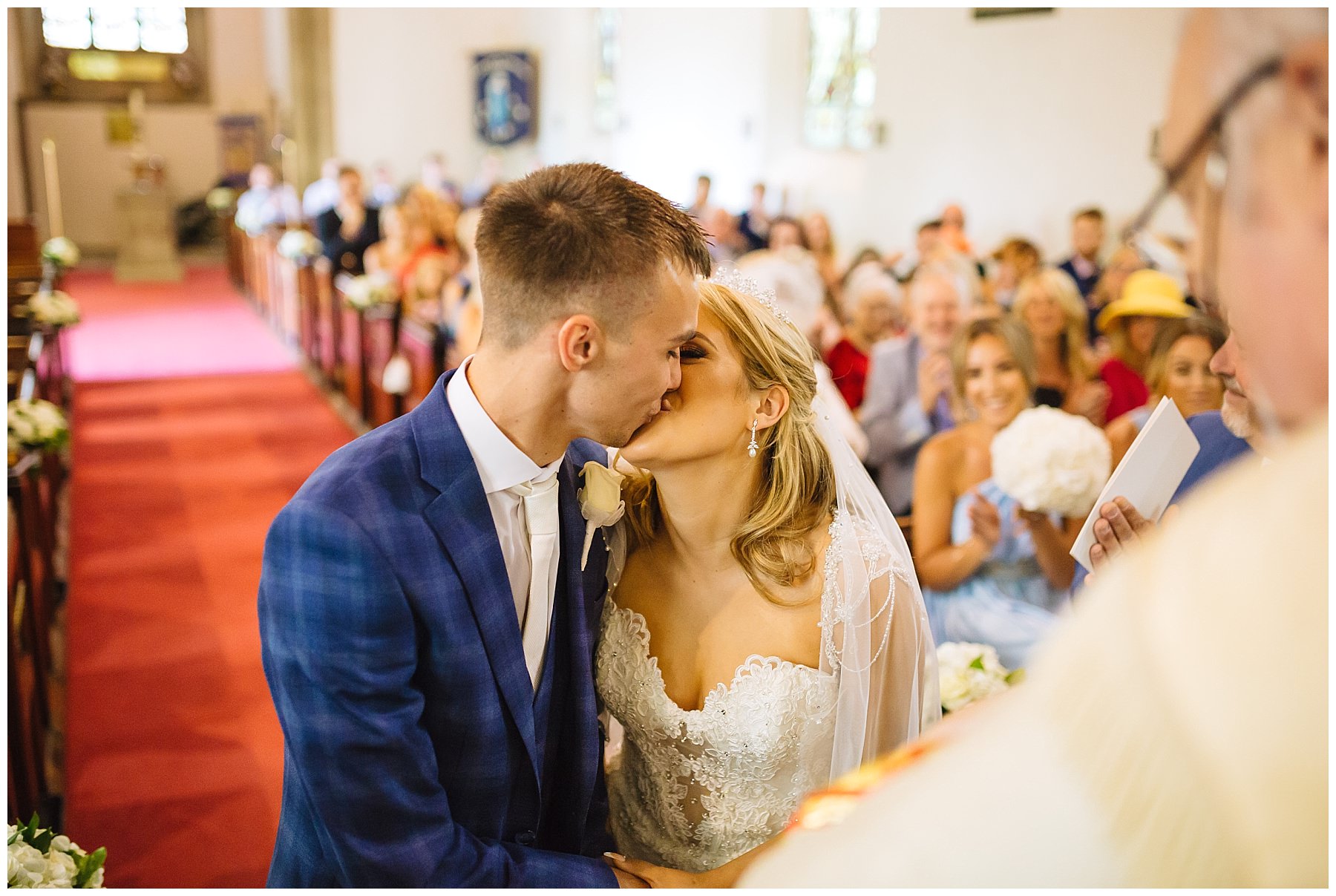 bride and groom kiss at Lancashire wedding ceremony