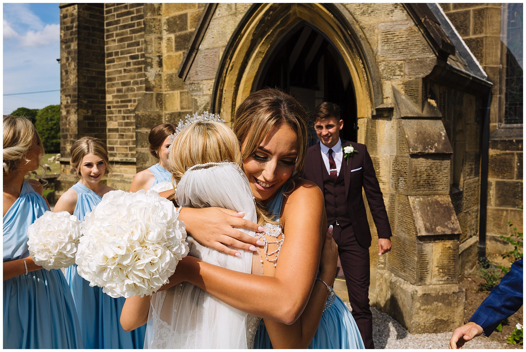 hugs and celebrations with newly weds outside church