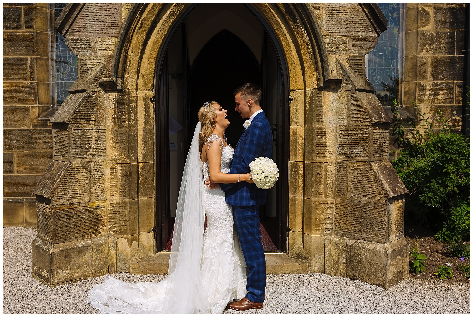 Bride and Groom laugh outside Lancashire Church