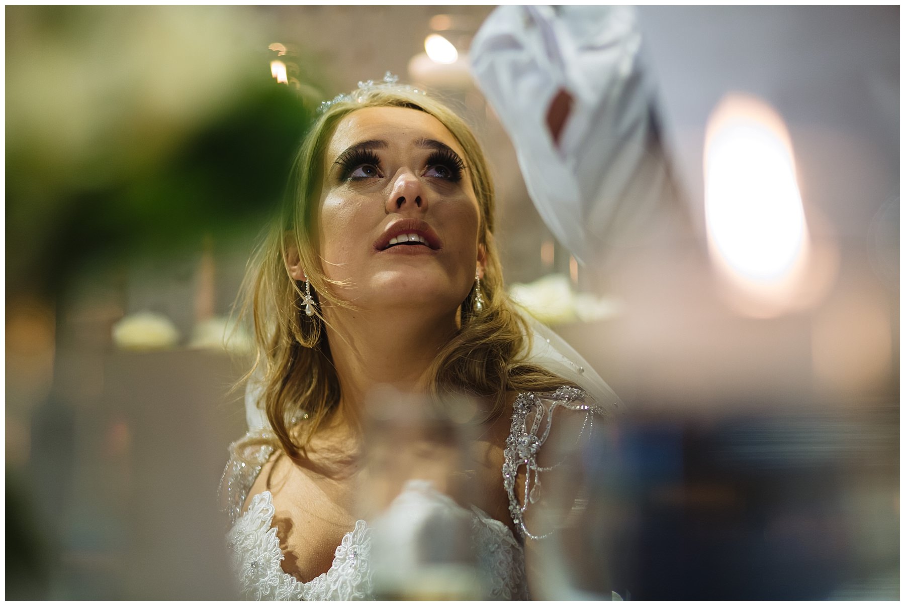 bride looks up at dad during his speech