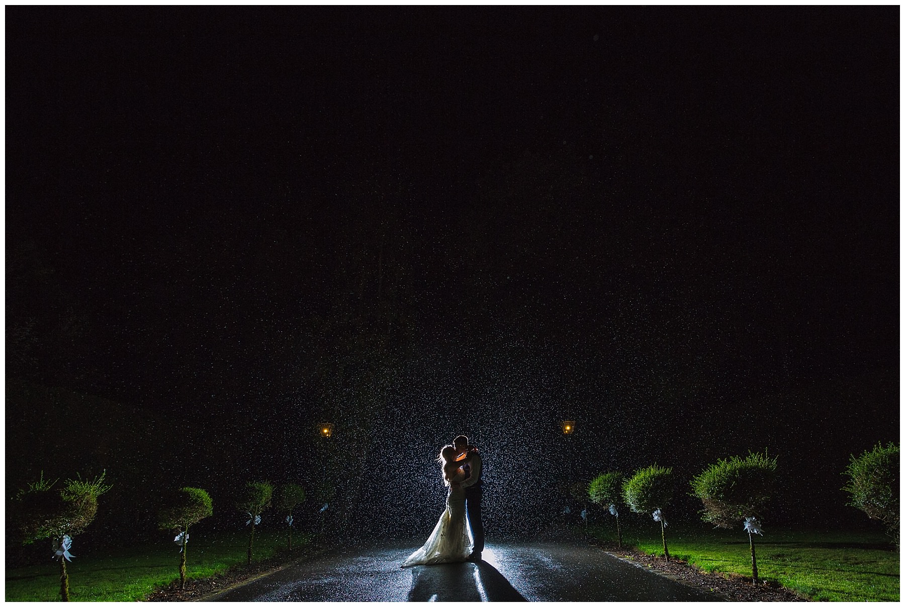 Couple in the rain for night portraits at Bartle Hall