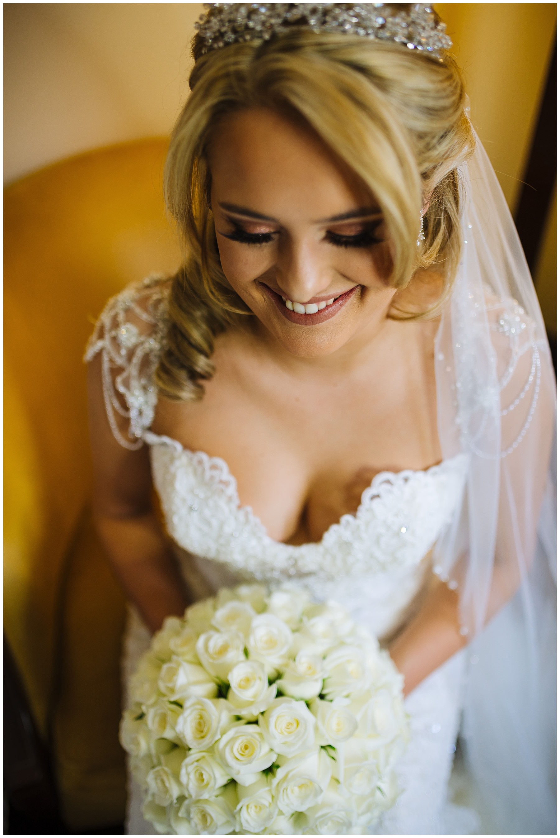 stunning bride smiles for portrait before wedding
