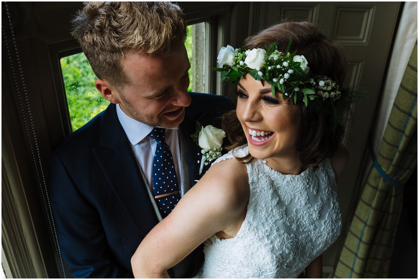 married couple laugh and smile at mitton hall