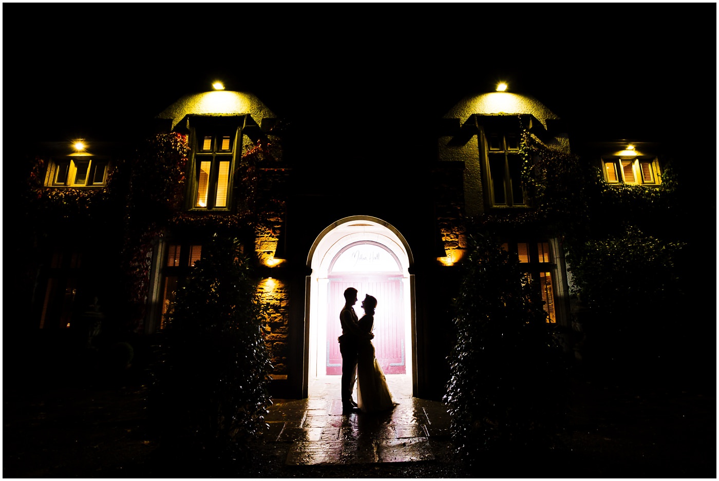 Creative wedding portrait outside Mitton Hall at Night