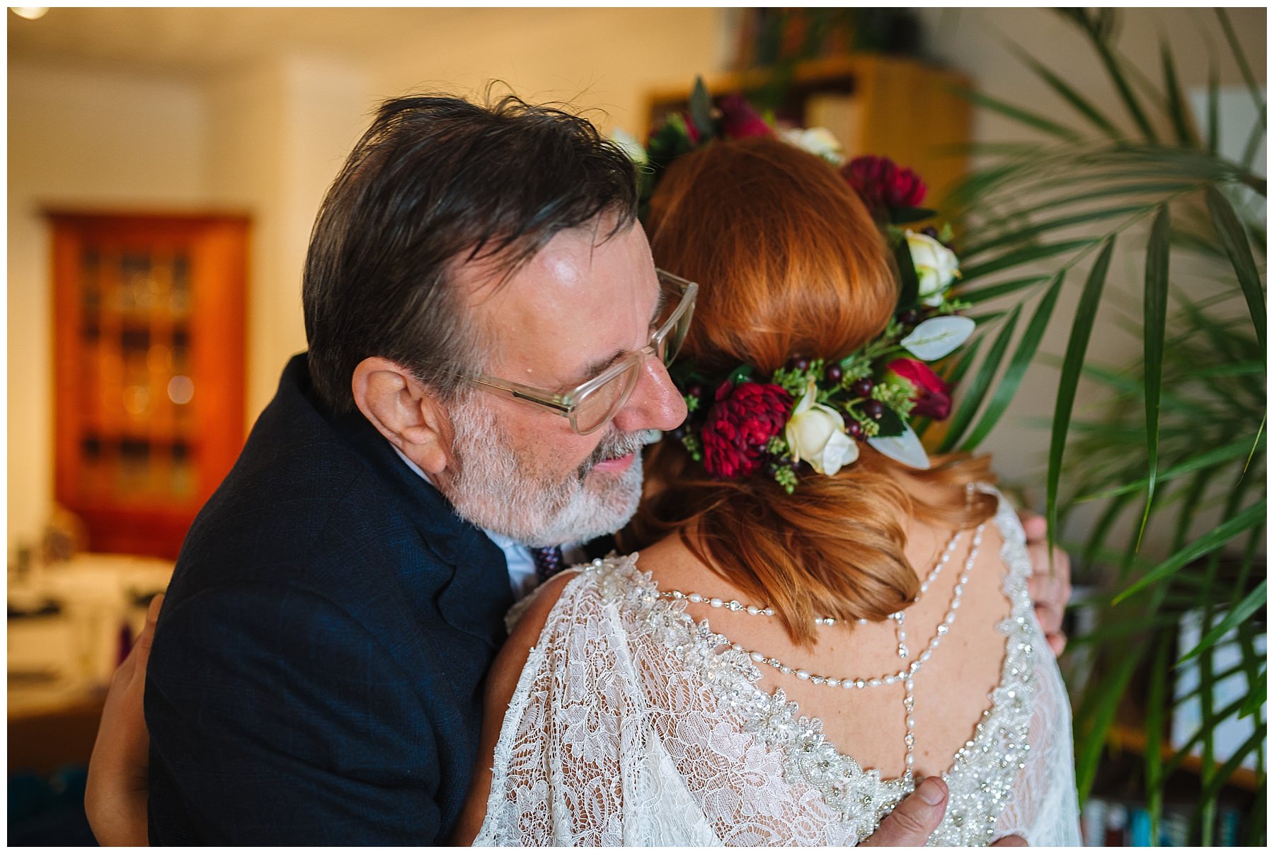 dad and daughter hug on morning of wedding