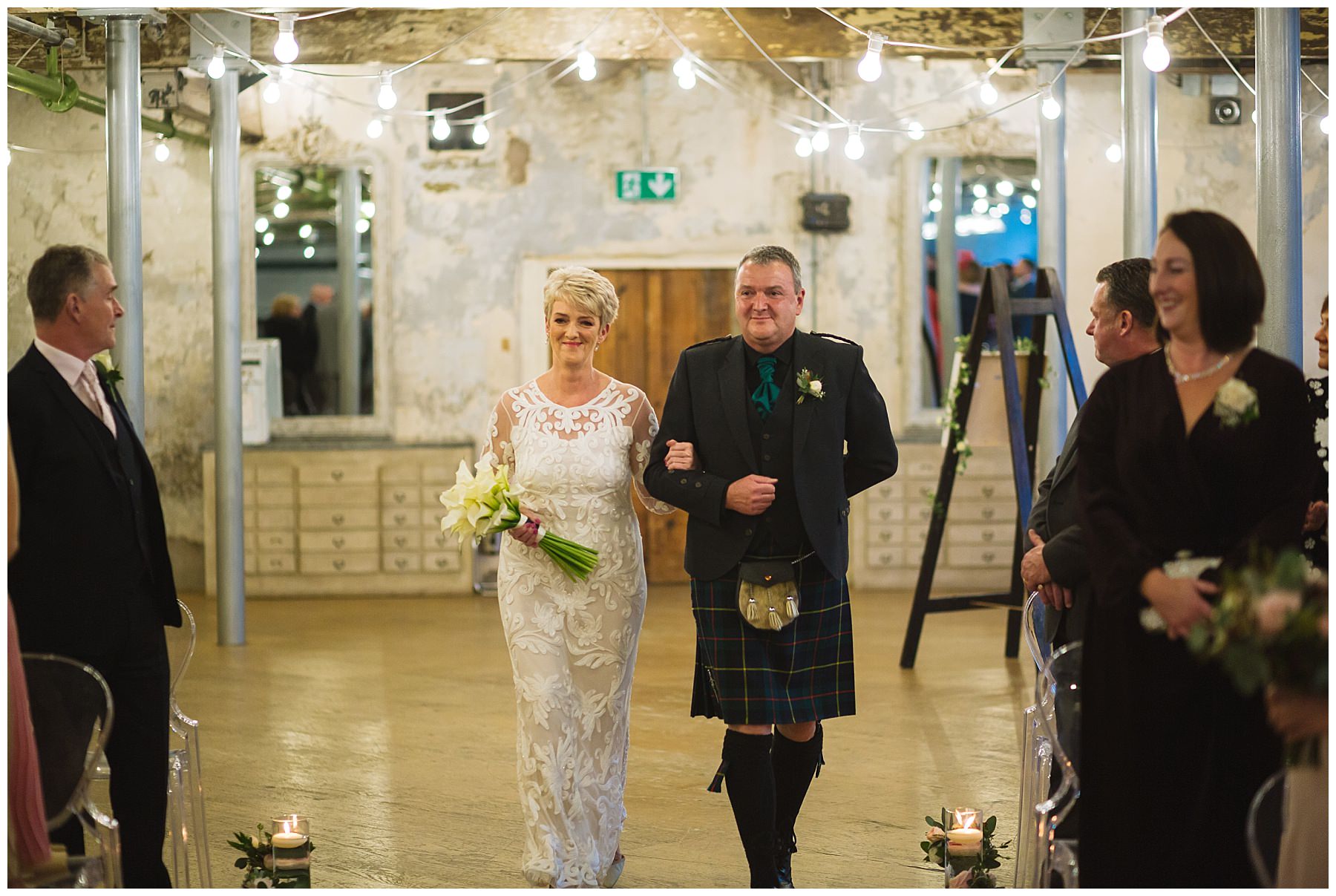 Bride walked down the isle by her brother who wears family tartan
