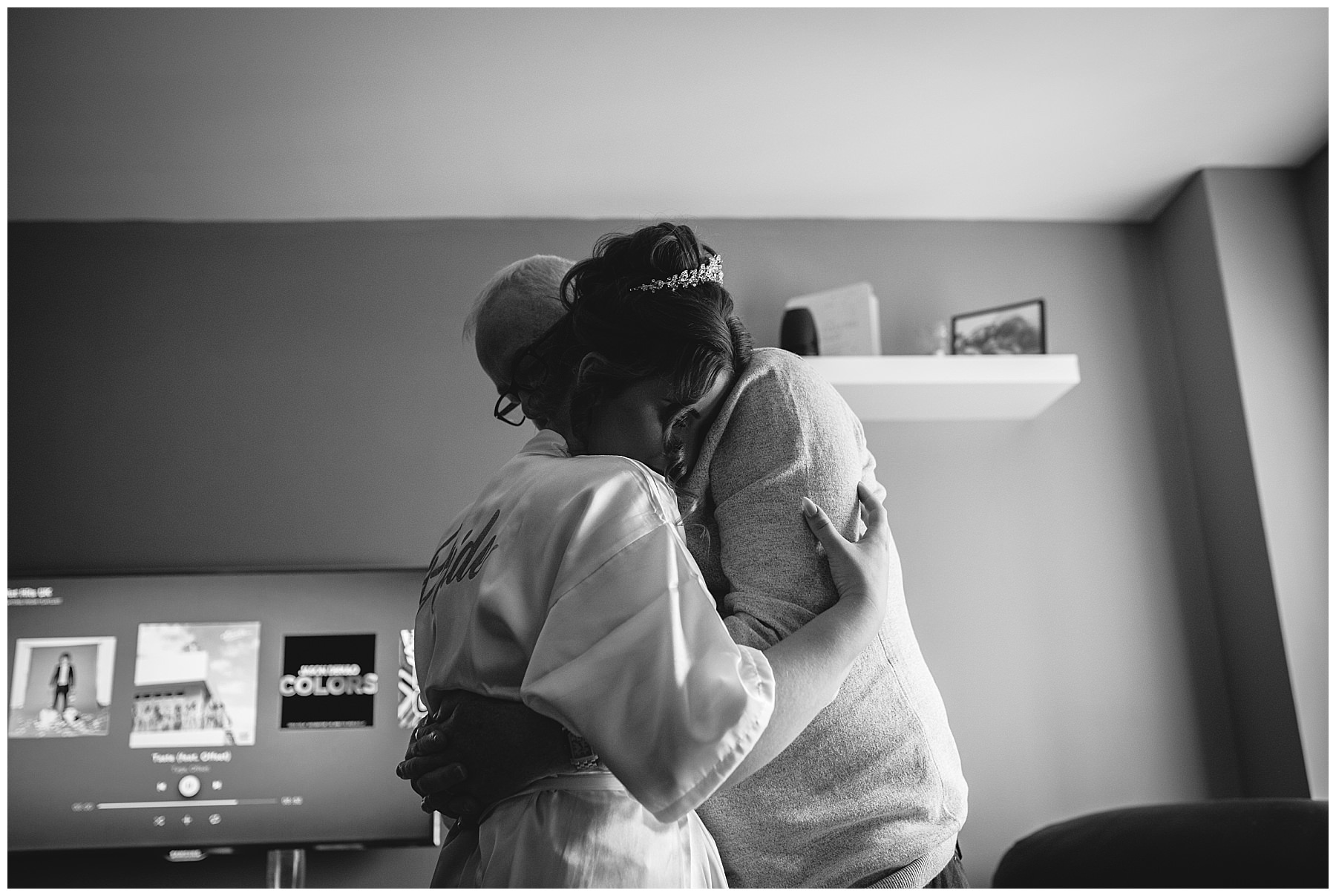 bride and father share a hug on the morning of her wedding