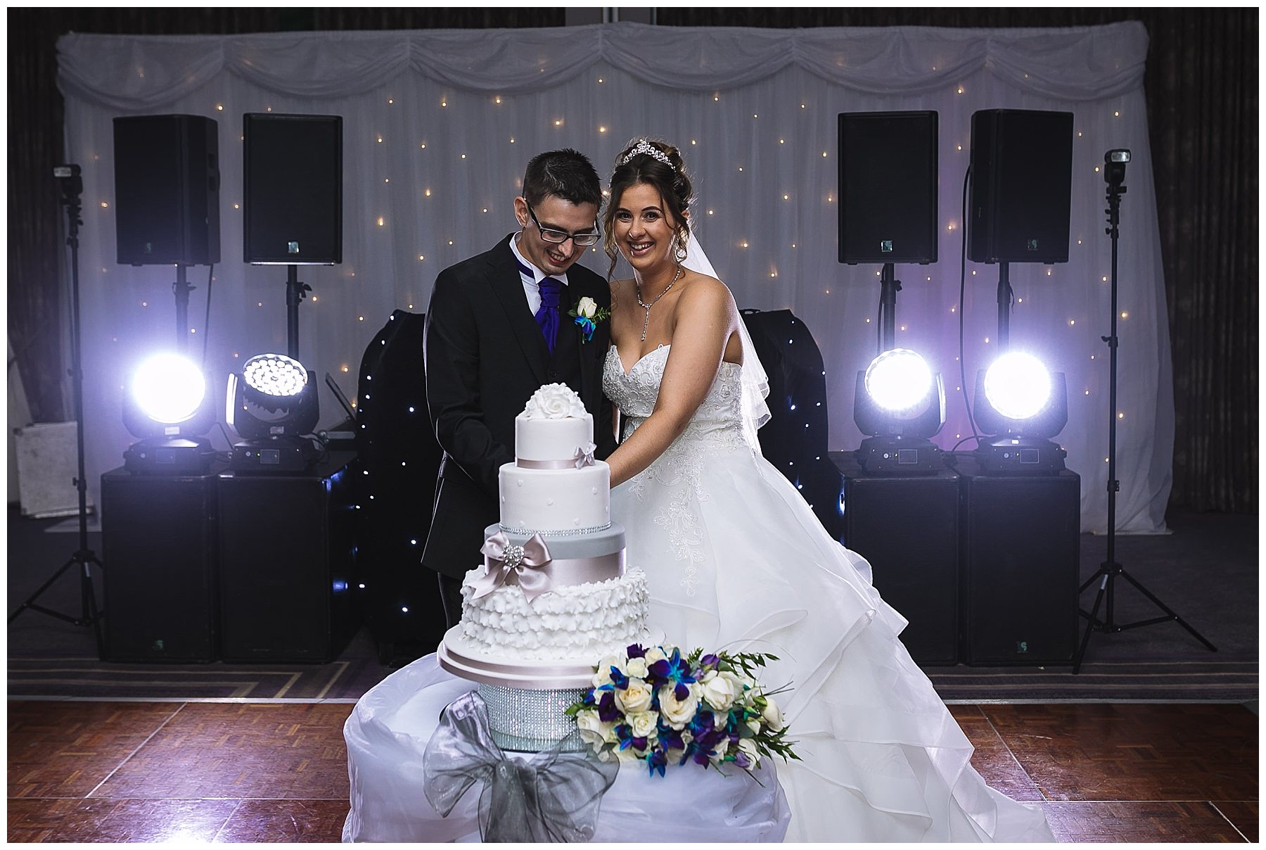 bride and groom cut wedding cake at kilhey court