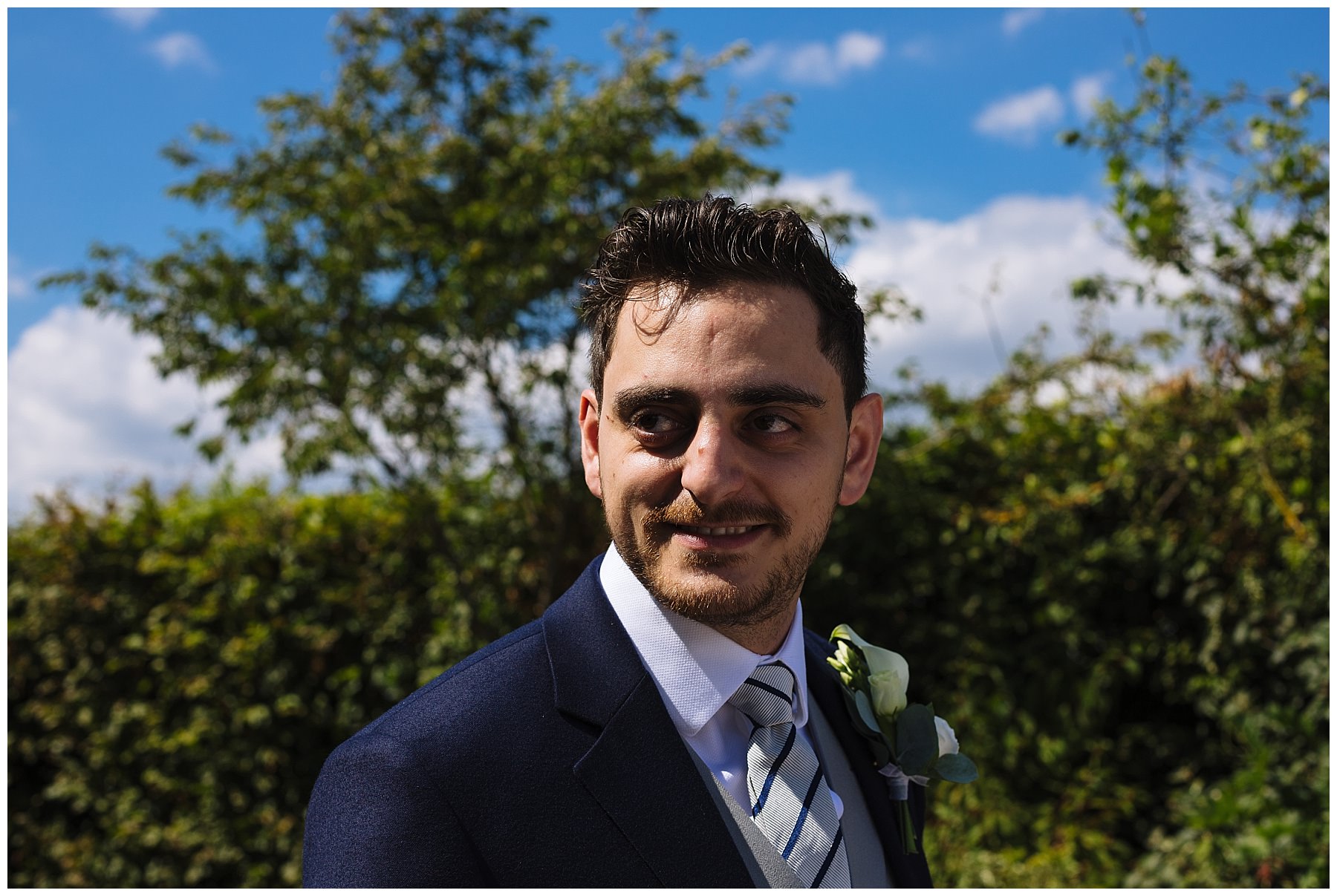 Groom awaits his bride for outdoor ceremony at Pryors Hayes