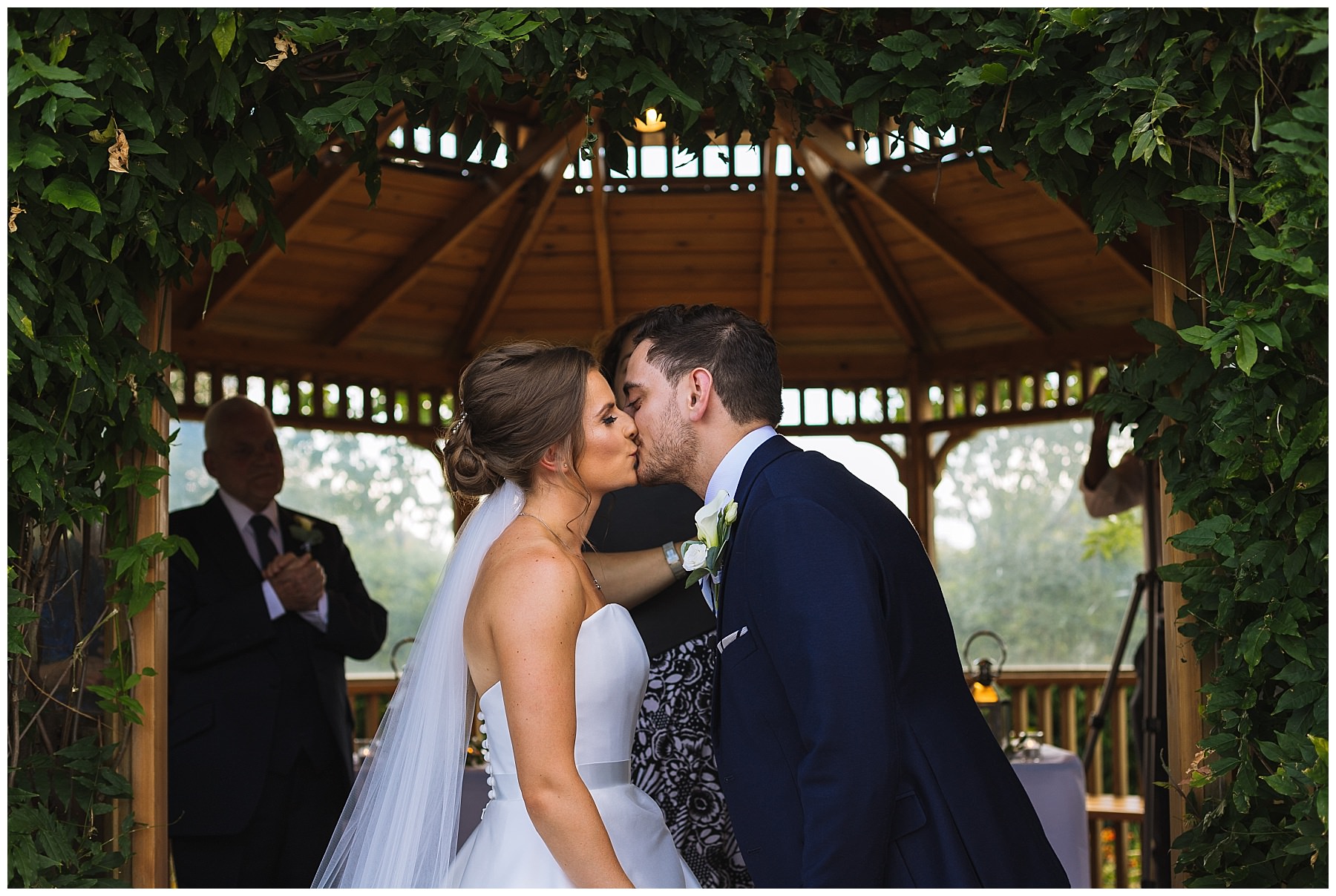 first kiss as husband and wife at outdoor ceremony