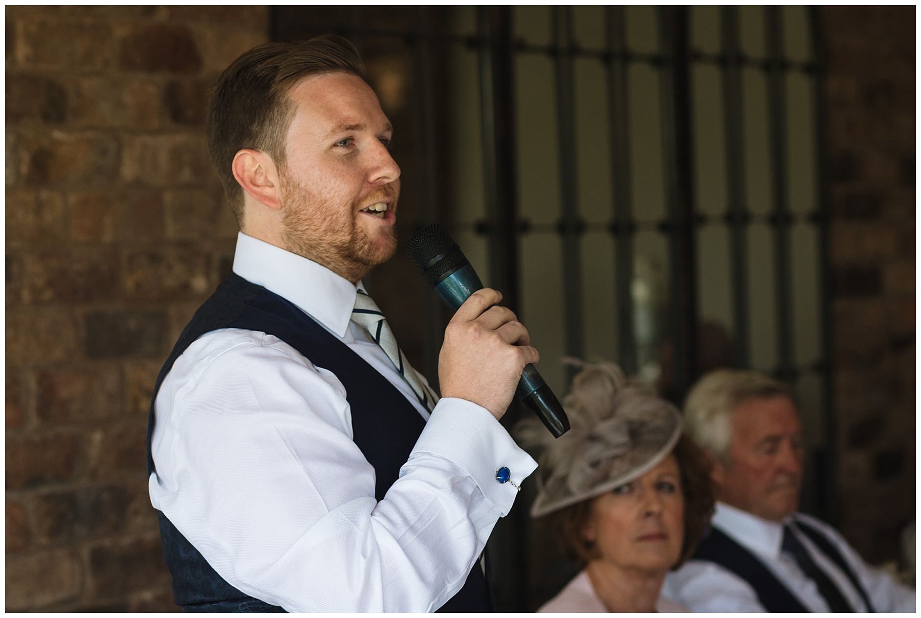 Best man addresses guests during wedding breakfast