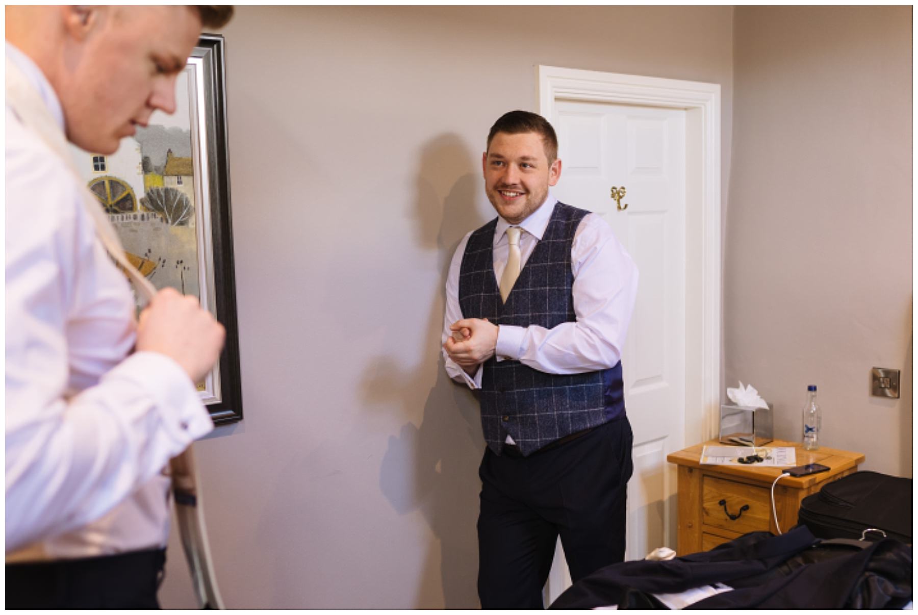 groom and groomsmen get ready for eaves hall wedding