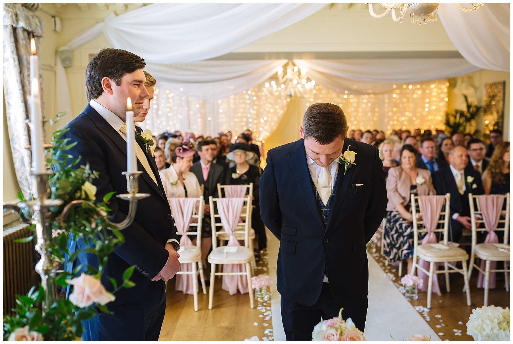 Groom waits nervously for bride in Eaves hall wedding ceremony room