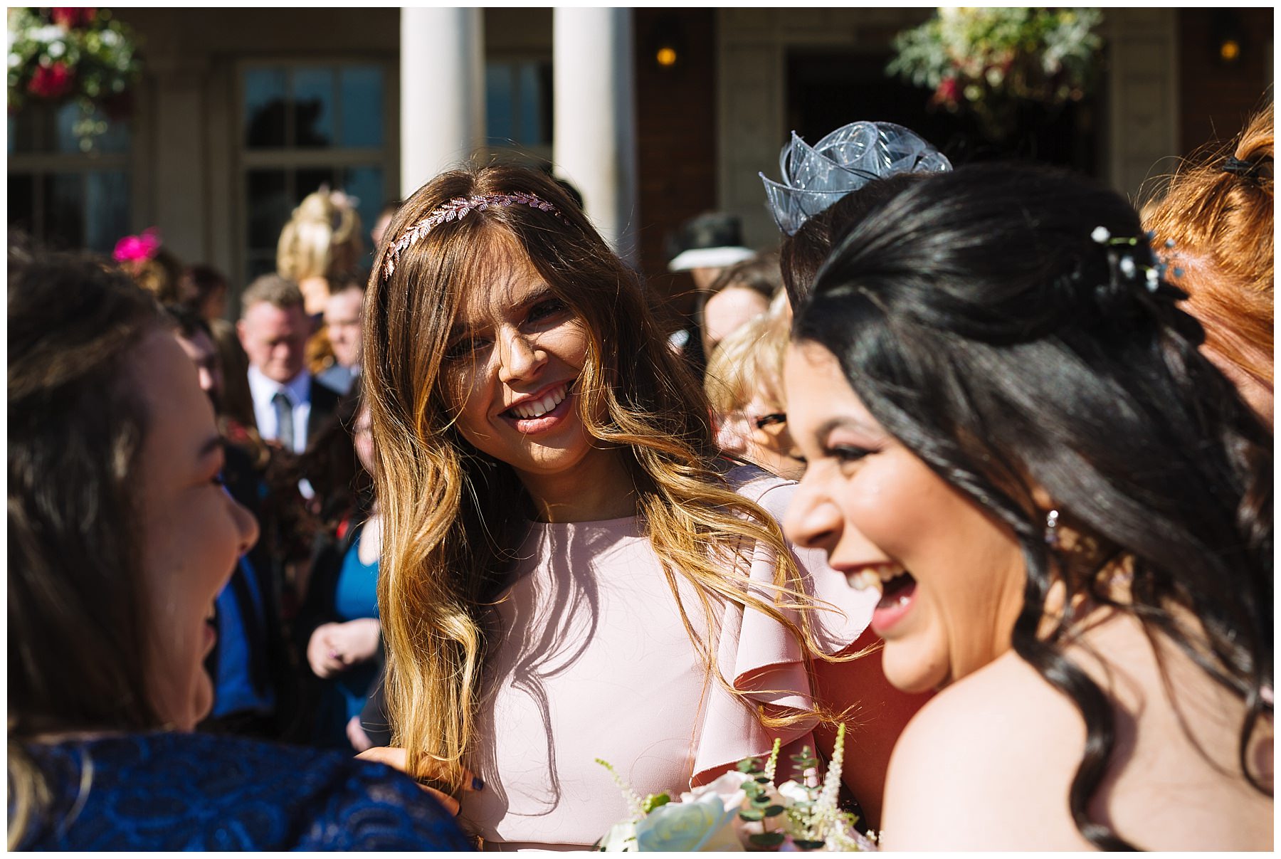 wedding guests enjoy the winter sun at eaves hall
