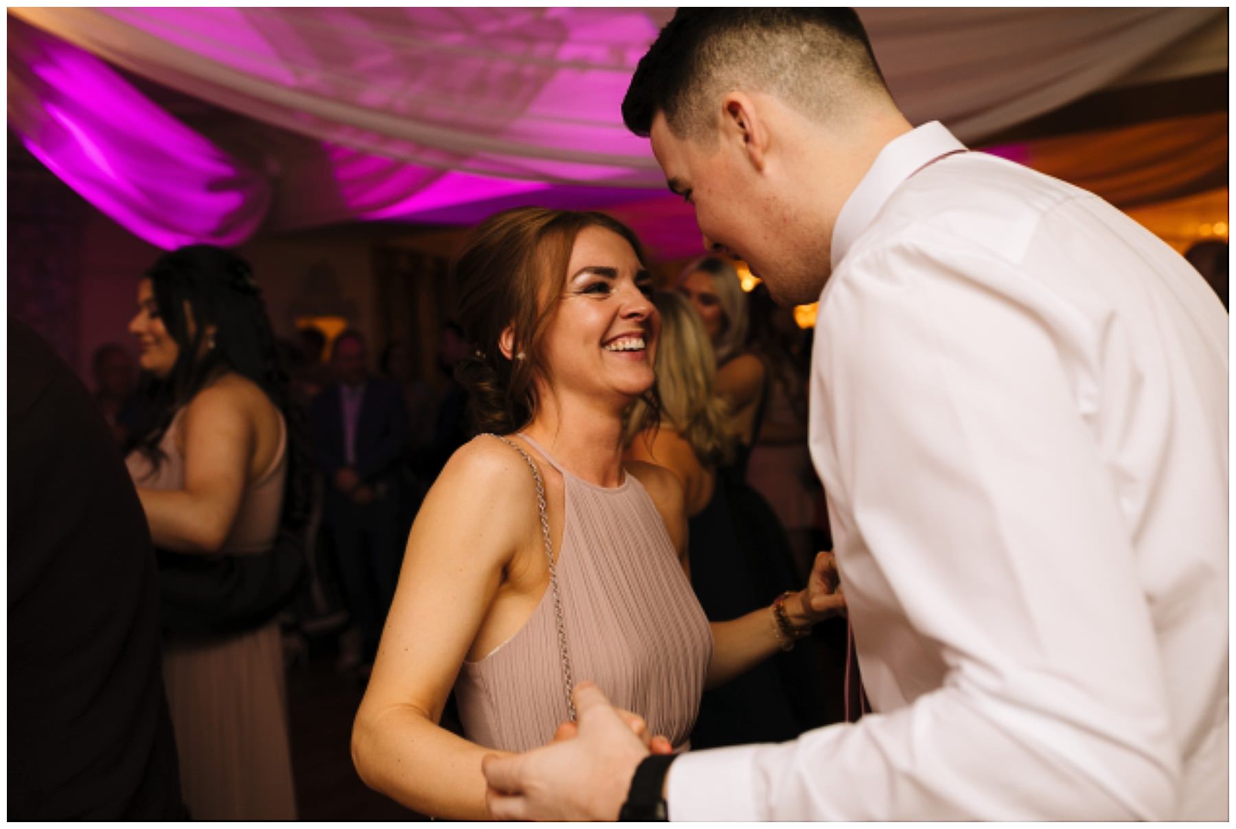 wedding guests on the dance floor at eaves hall